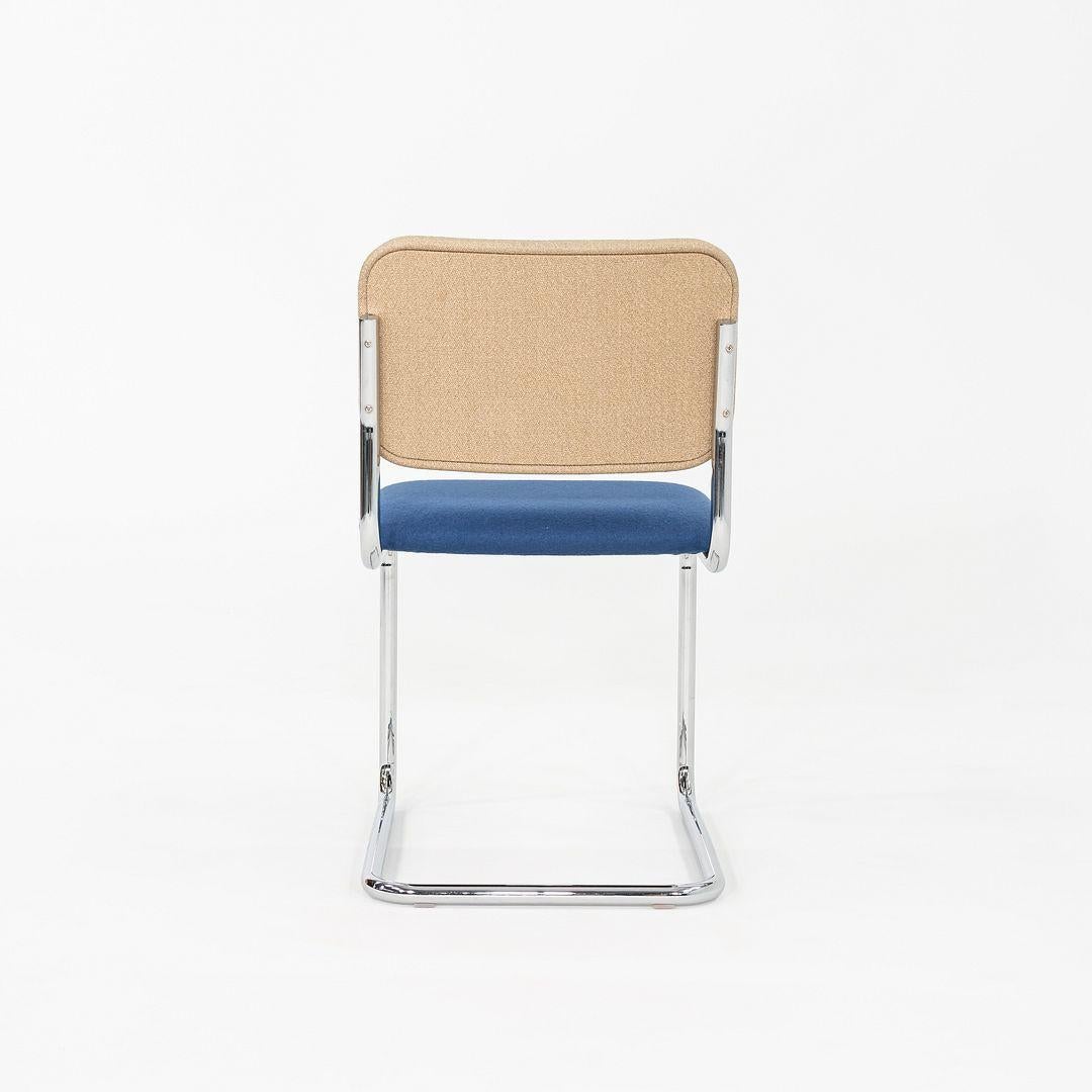 This is a set of five Cesca Armless Side Chairs, originally designed by Marcel Breuer in 1928. These examples were manufactured by Knoll in 2019. Their design features a tubular chromed-steel cantilever base with a molded plywood seat and back that