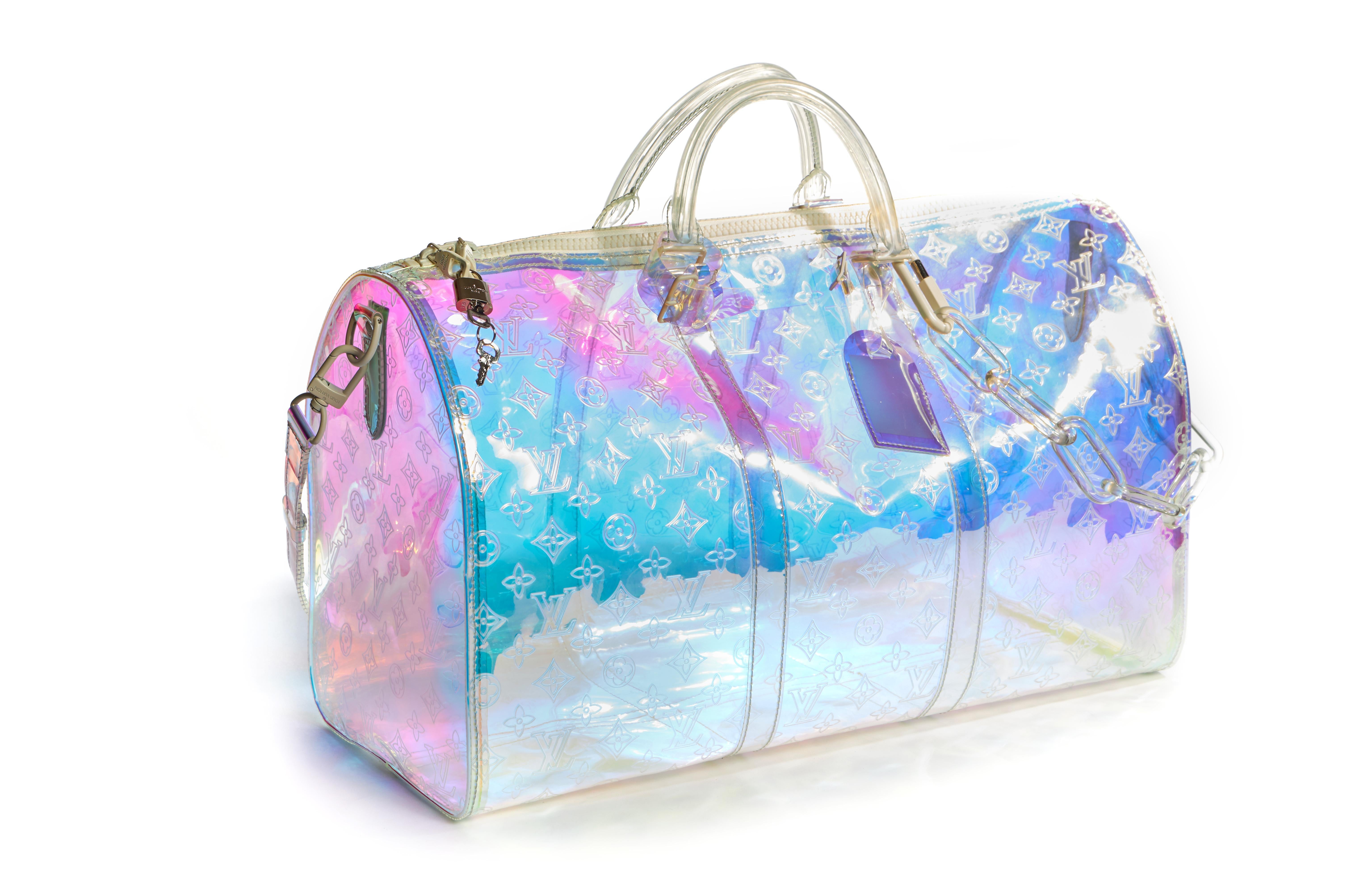 Louis Vuitton sold out prism keep all 50cm. Designed by Virgil Abloh for runway spring summer 2019. Embossed iridescent pad, detachable strap and charm chain. Minor wear on one handle . Generic dust cover .