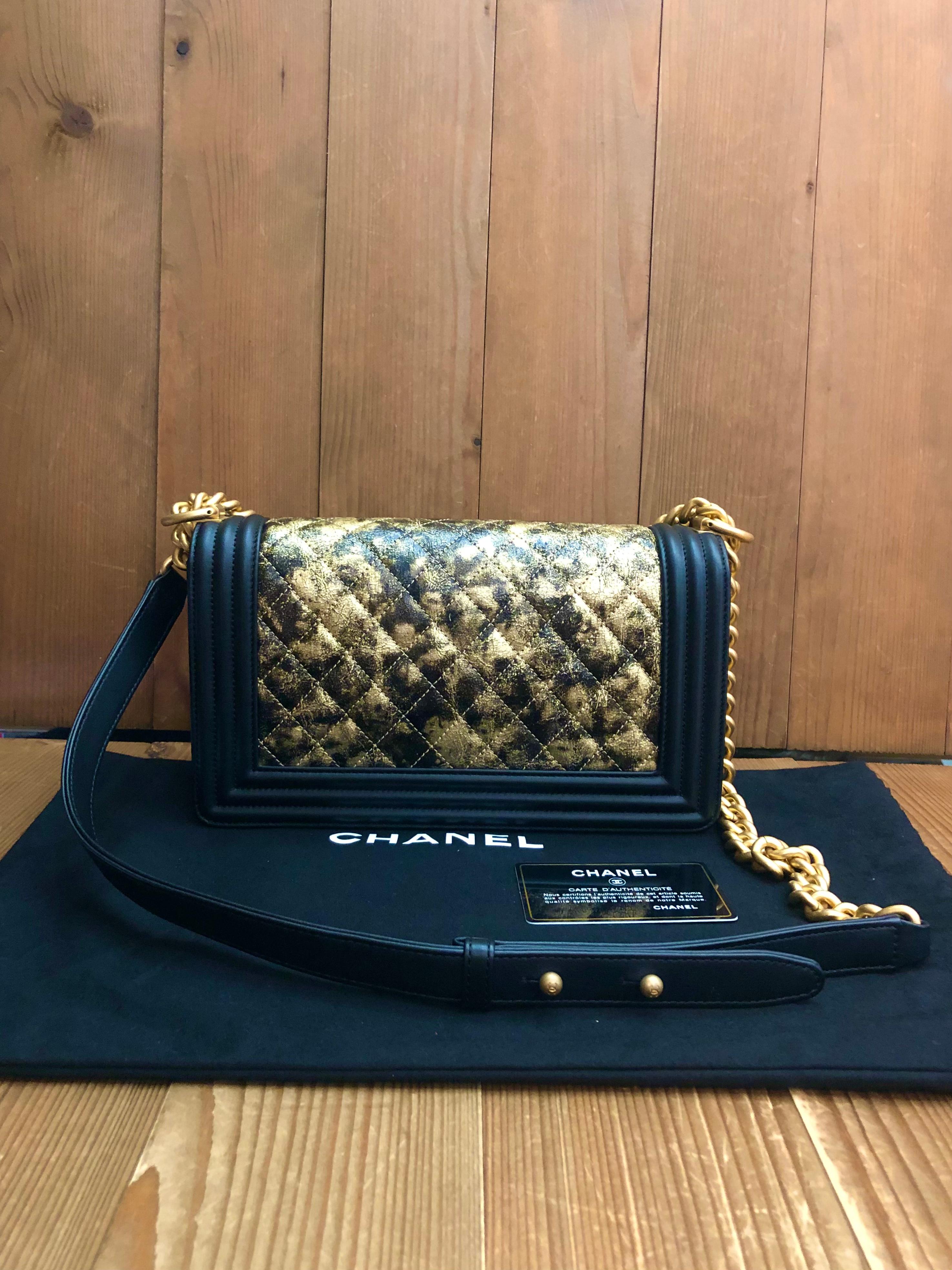 This CHANEL Medium Boy bag is crafted of diamond quilted black and rose gold metallic crumpled goatskin leather featuring matte gold-toned hardware. Front flap Boy push-lock closure opens to a black textile interior featuring a patch pocket. This