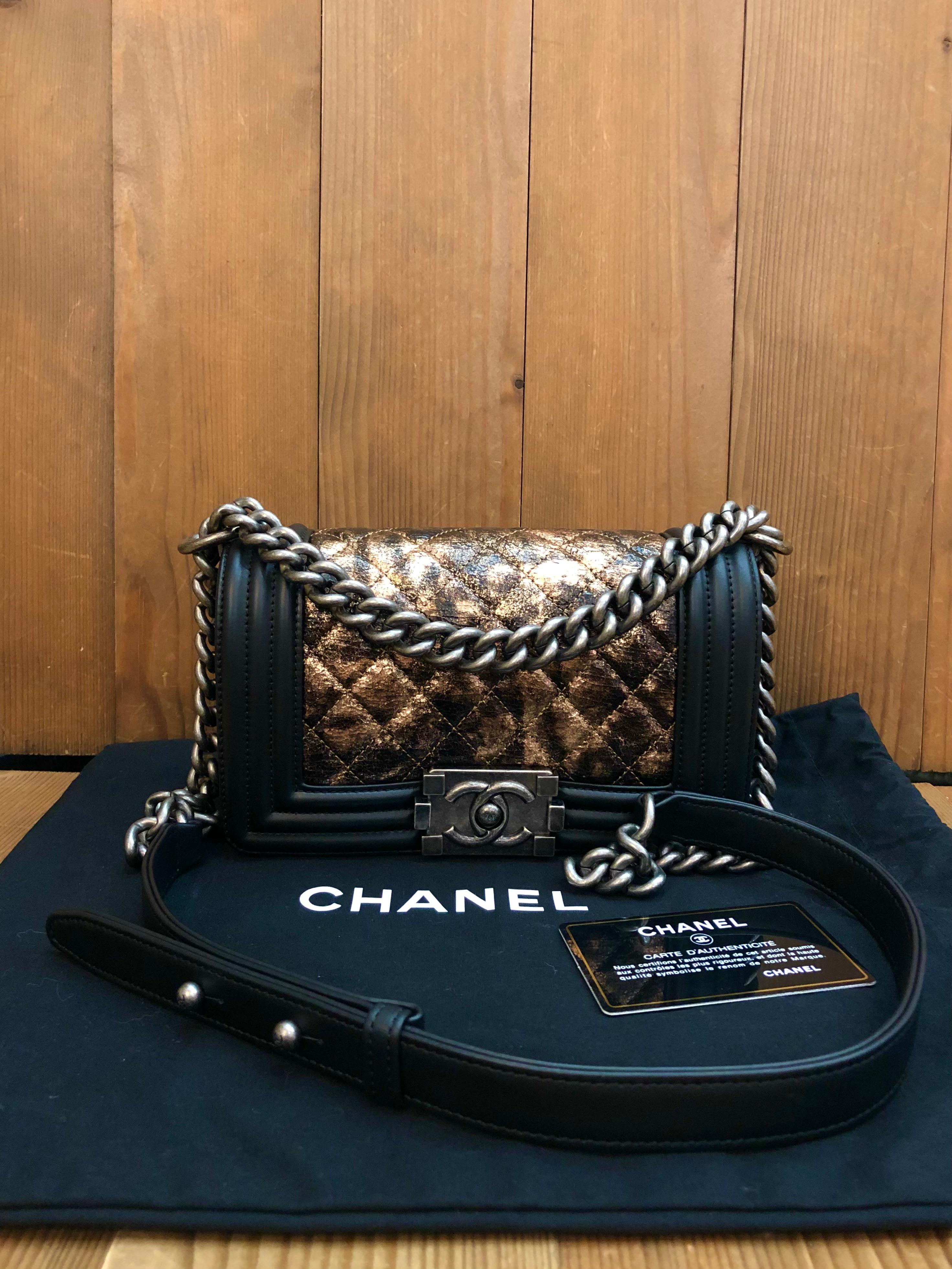 This CHANEL Small Boy bag is crafted of diamond quilted black and rose gold metallic crumpled goatskin leather featuring chrome silver-toned hardware. Front flap Boy push-lock closure opens to a black textile interior featuring a patch pocket. This