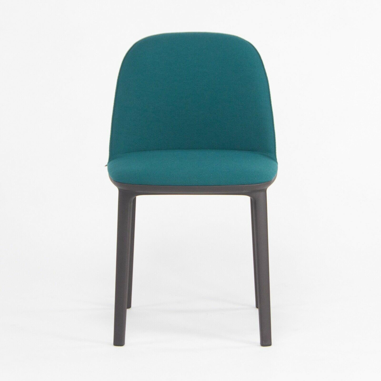 Listed for sale is Softshell Side Chair designed by Ronan and Erwan Bouroullec and produced by Vitra. This chair was constructed with a chocolate colored (very dark) plastic base and seat upholstered with teal blue/green fabric. The condition is