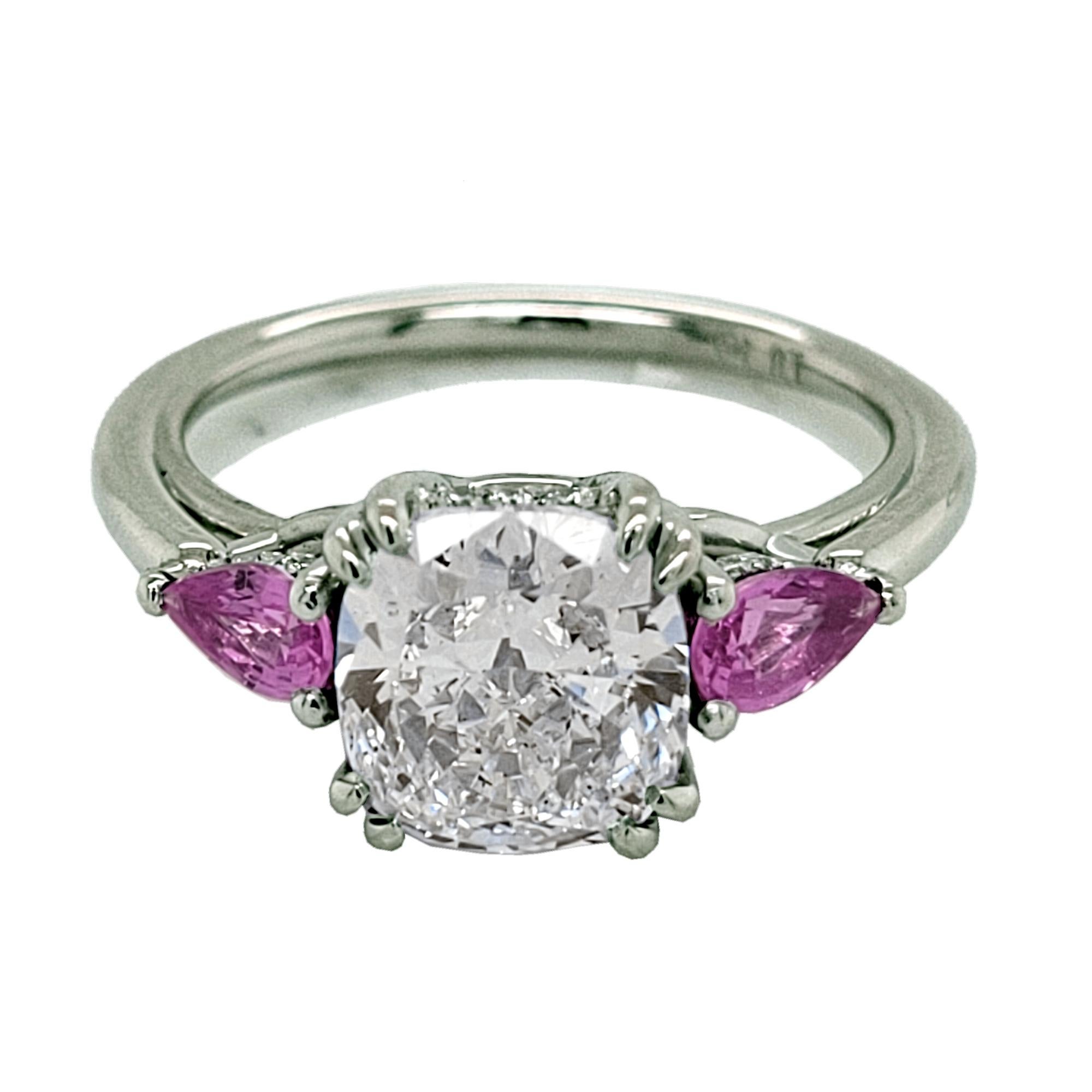 A beautiful 2.01 Ct Cushion D/SI1 GIA Certified Diamond set in the center of a Platinum 3 stone  with two Pear Shape Rubies on the side and hidden Halo (pave Set with diamonds) engagement ring. 

Details:
Center Stone: 2.01 carat D/SI1 GIA Certified