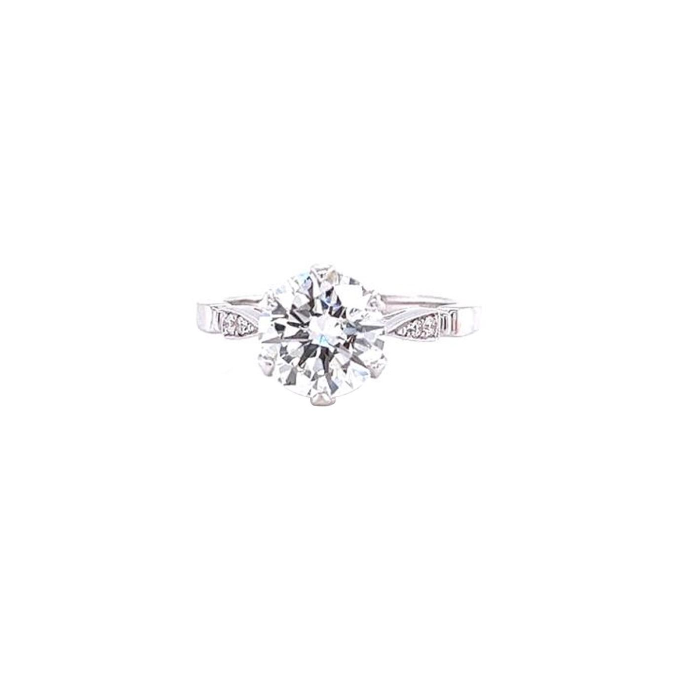 This Timeless Piece Natural Diamond Engagement Ring Features a 2.05 Carat Round Cut Diamond crafted in 18K Gold with dimensions of 7.89 - 7.96 x 5.06 mm. It has a Round Natural cut Main Stone with Pave Diamonds, a VS2 clarity grade with I Color, GIA