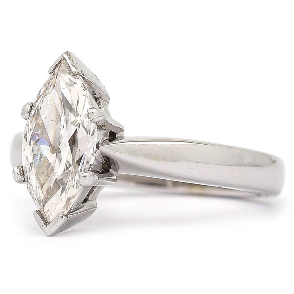 A modern 18 karat white gold and platinum claw set marquise diamond ring the diamond is 2.01ct, I colour and SI1 clarity. It is a pre-loved ring with very little signs of wear and would make for a fabulous engagement ring or wedding ring. It comes