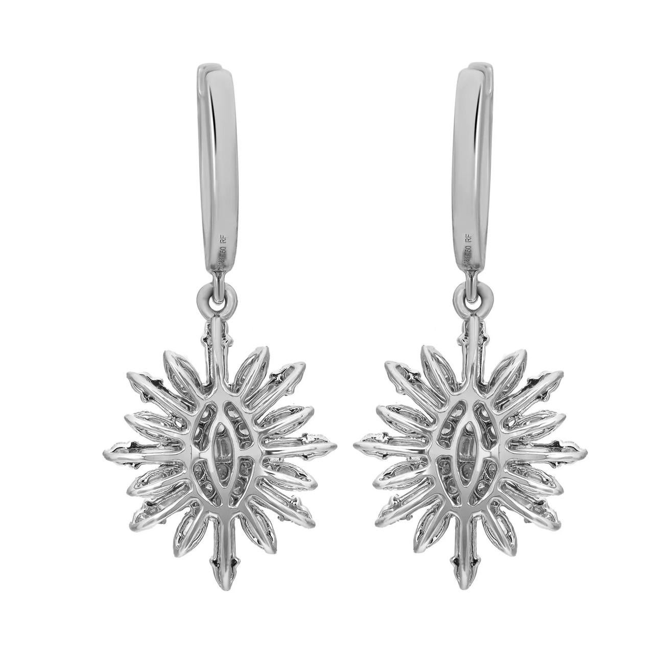 
Indulge in sophistication with these chic diamond drop earrings, meticulously fashioned in luxurious 18K white gold. Their allure is heightened by a captivating arrangement of sparkling baguette and round brilliant cut diamonds, expertly set in a