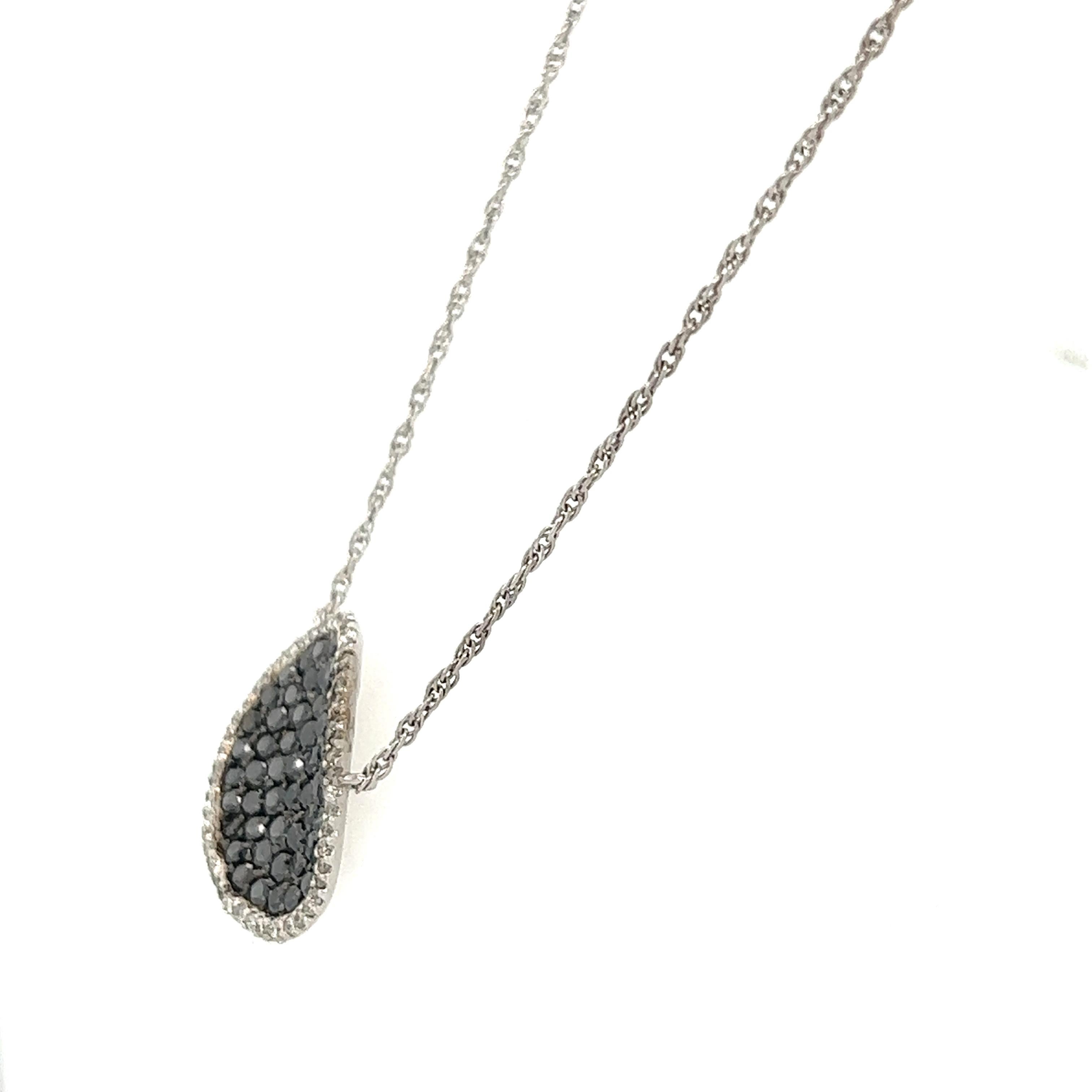 This necklace has Natural Black Diamonds that weigh 1.64 carats and Natural Round Cut Diamonds that weigh 0.38 carats. 
(Clarity: SI, Color: F) The total carat weight of the chain necklace is 2.02 carats.

The necklace is made in 14 Karat White Gold