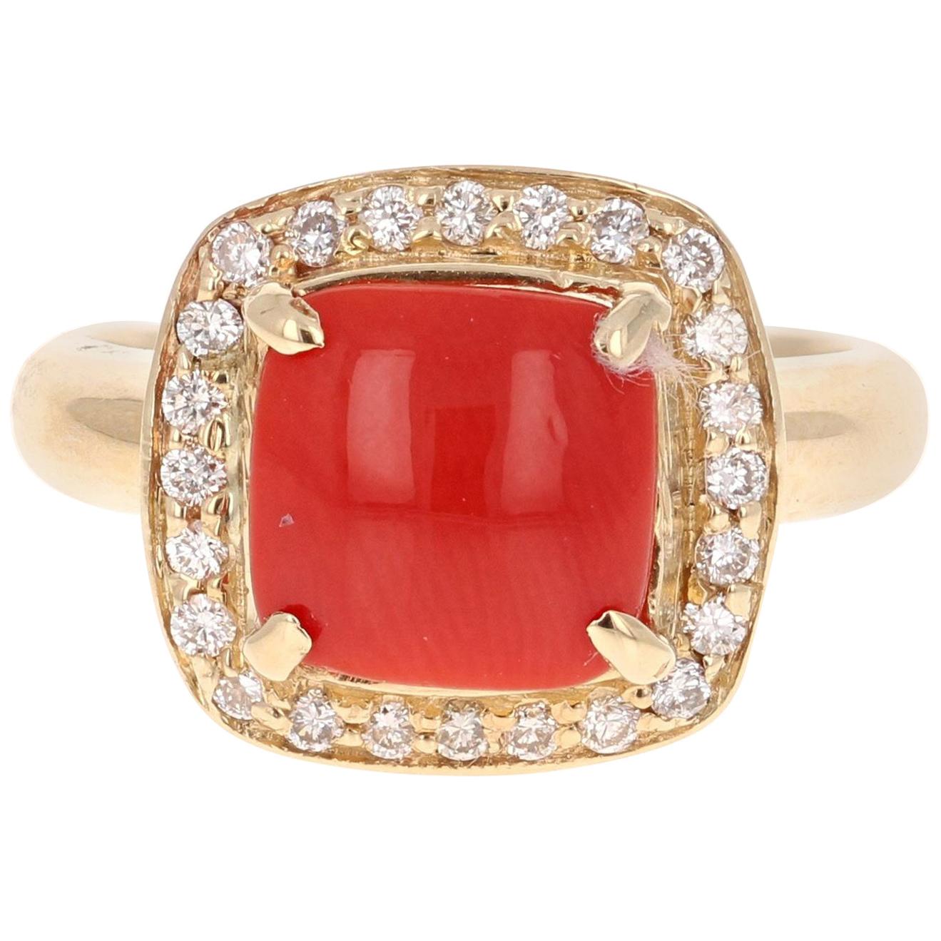Coral Diamond 14 Karat Yellow Gold Halo Ring

The Coral weighs 1.70 carats and is adorned by 24 Round Cut White Diamonds weighing 0.32 Carats. The Total Carat Weight of this beauty is 2.02 carats. 
It is crafted in 14K Yellow Gold and weighs 7.8