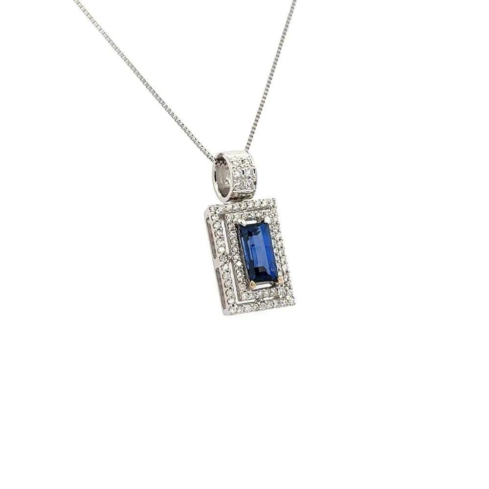 Simply Beautiful! Emerald Cut Ceylon Sapphire GIA and Diamond Gold Double Halo Pendant Necklace. Centering a securely Hand set 2.02 Carat Emerald Cut Sapphire. GIA #2235320576. Surrounded by Round Brilliant Cut Diamonds, approx. 0.48tcw. Pendant