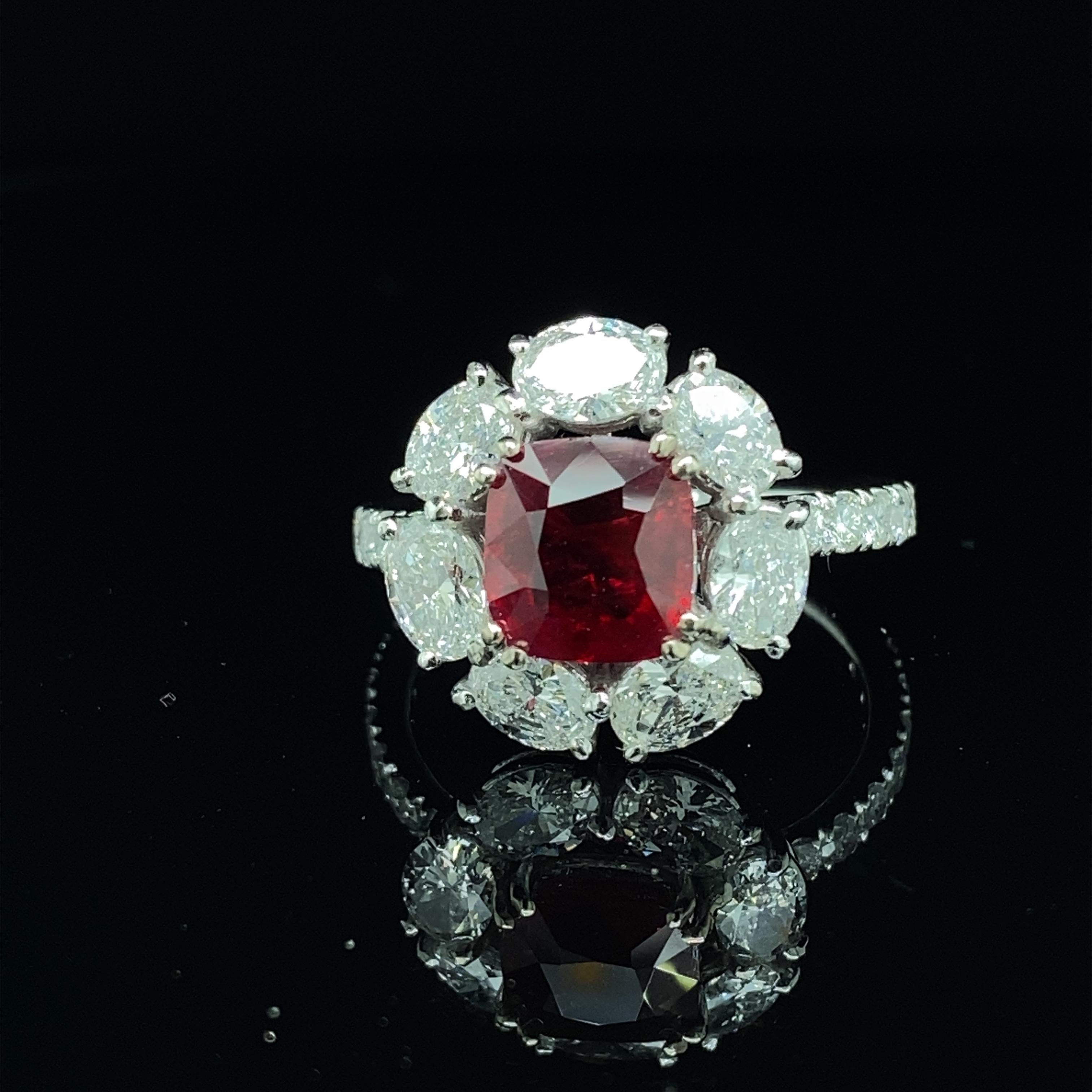 2.02 Carat GRS Gubelin Certified Burma No Heat Pigeon's Blood Red Ruby Gold Ring:

A superb and rare jewel, it features a stunning GRS and Gubelin Labs certified Burmese unheated pigeon's blood red ruby weighing 2.02 carat, surrounded by a halo of