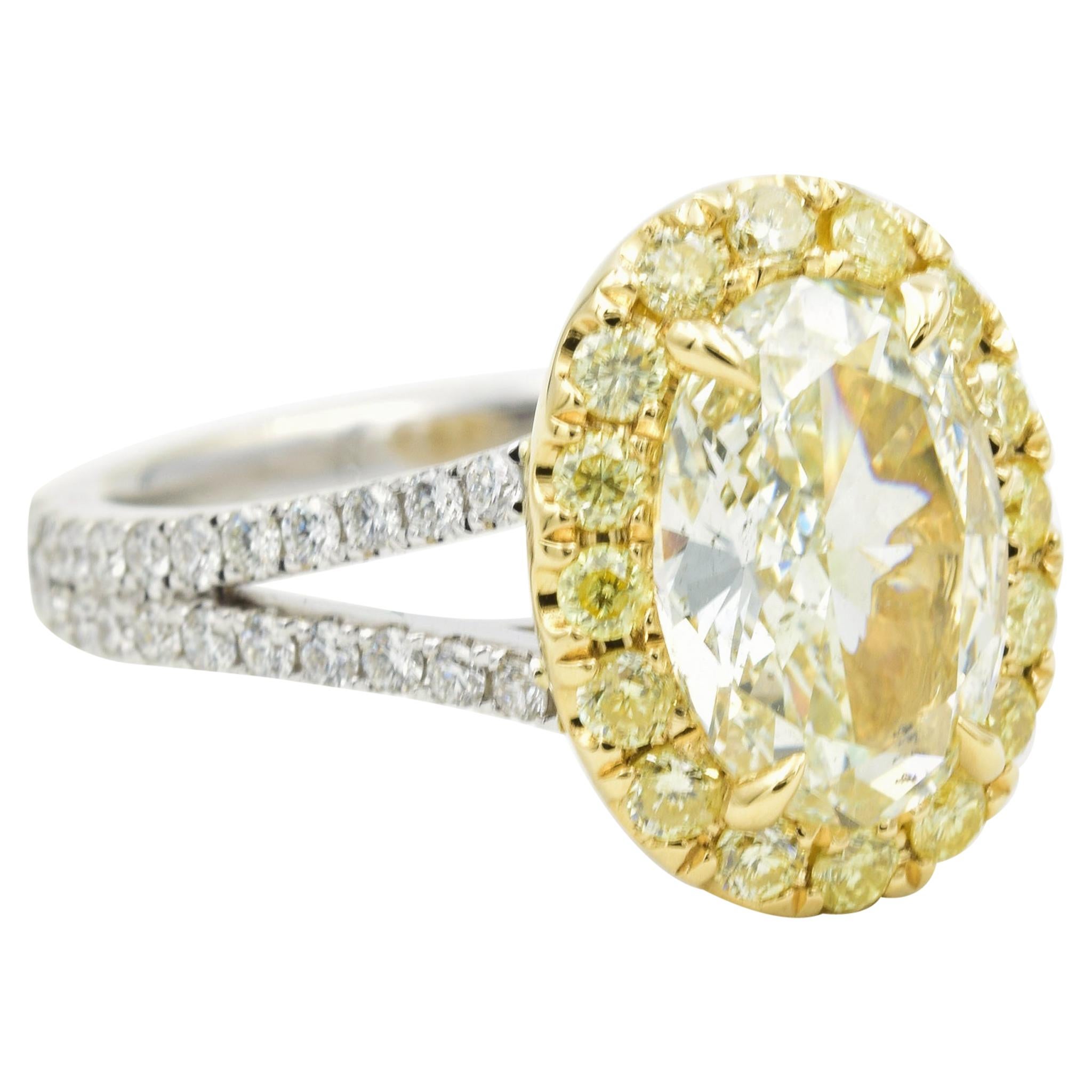 2.02 Carat Oval Fancy Light Yellow Diamond Ring