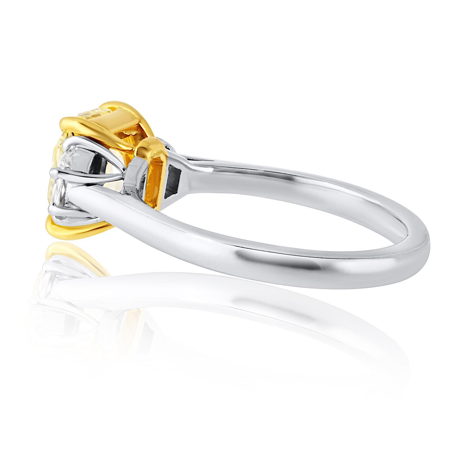 2.02 Carat Radiant Cut Fancy Intense Yellow Three-Stone Diamond Engagement Ring In New Condition For Sale In New York, NY