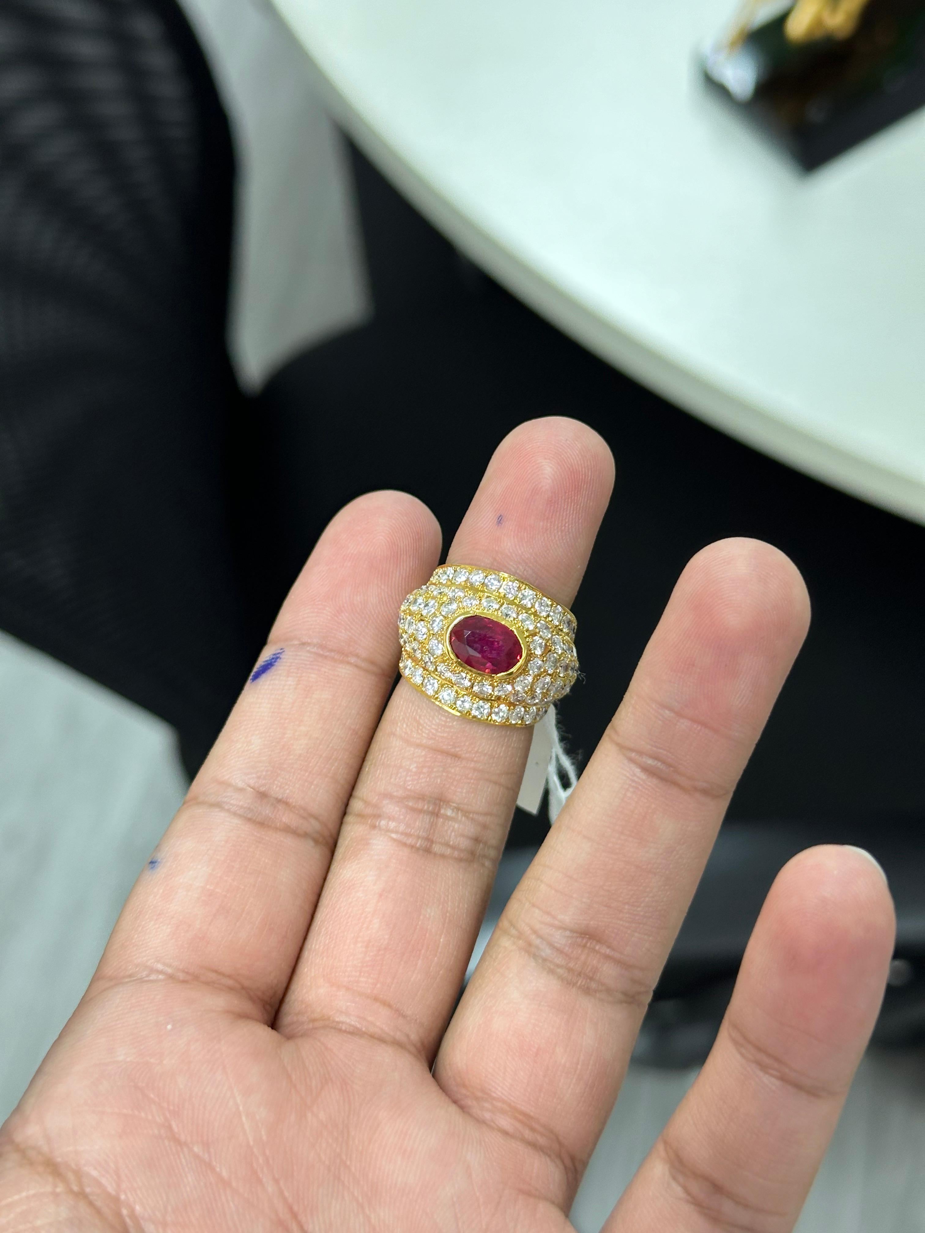 Indulge in the allure of exquisite jewelry with this captivating Ruby ring, a treasure that will leave all vintage jewelry enthusiasts and ruby lovers delighted. 

This magnificent ring showcases a breathtaking centerpiece—an oval-cut Ruby,