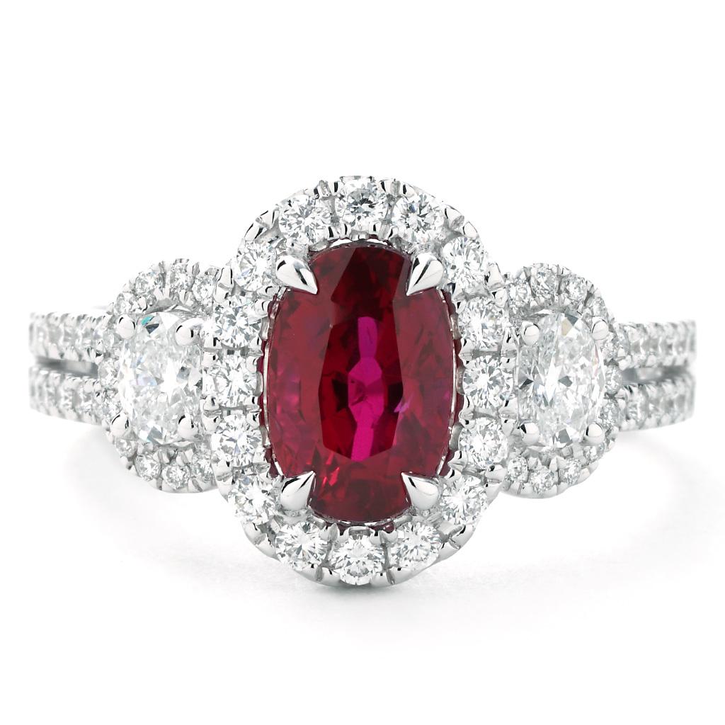 This is a one-of-a-kind Ruby and Diamond Split-Shank Ring! The center stone is an Oval cut 2.02 Carat Natural Unheated Ruby from Mozambique displaying an intense red 