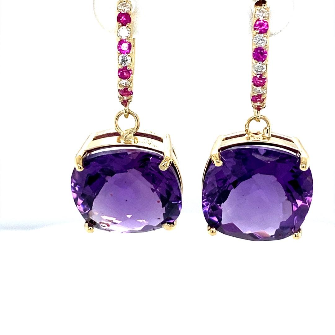 Amethyst, Pink Sapphire and Diamond Drop Earrings! 

These stunning Earrings have 2 large Cushion Cut Amethysts that weigh 19.84 Carats.  The Amethysts are embellished with alternating 10 Round Cut Diamonds that weigh 0.18 Carats (clarity: SI2,