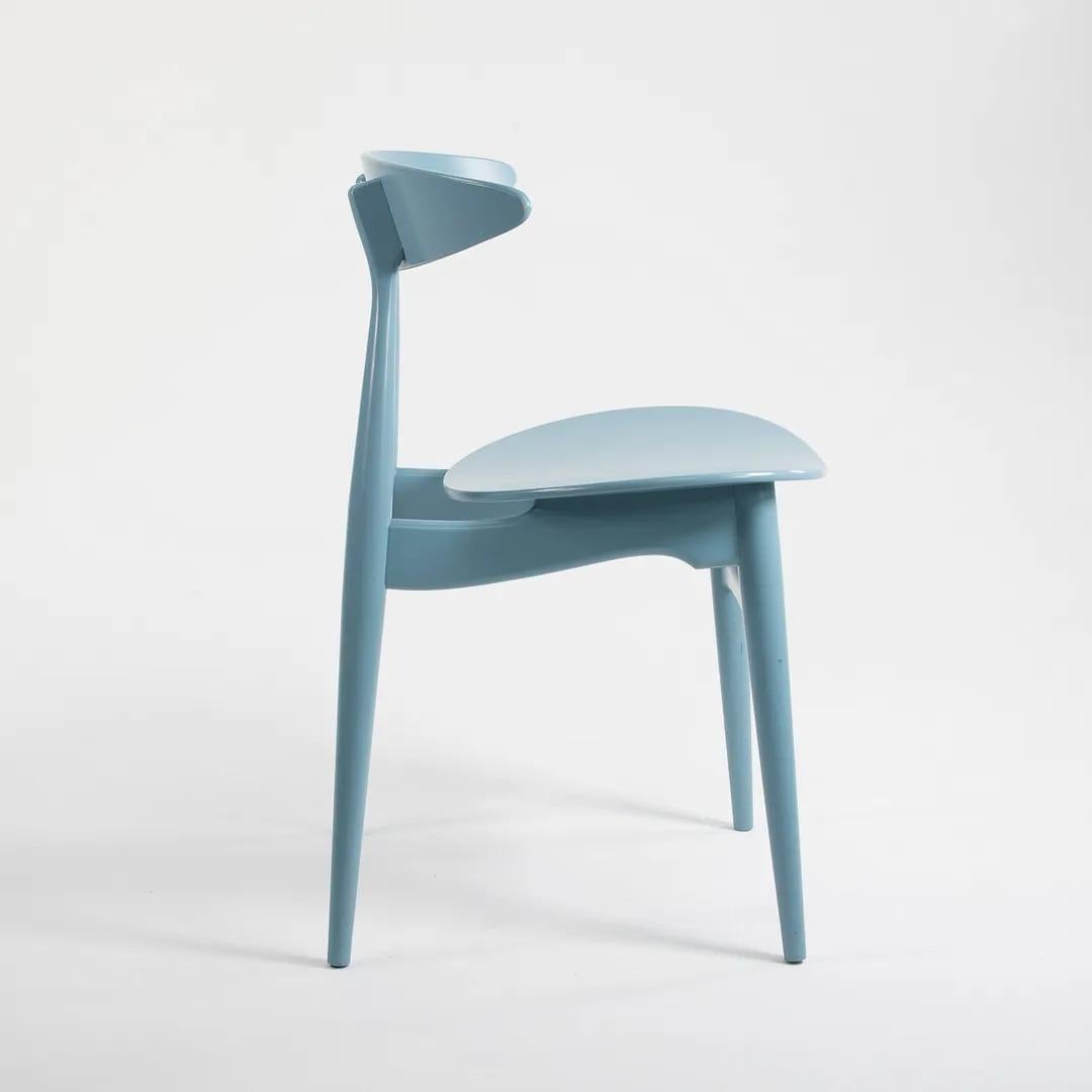 Listed for sale are two (sold separately) CH33T Chairs designed by Hans Wegner and produced by Carl Hansen & Son in Denmark. The chair is made with a solid beech frame and painted steel blue (we believe this to be the correct color, though it is not