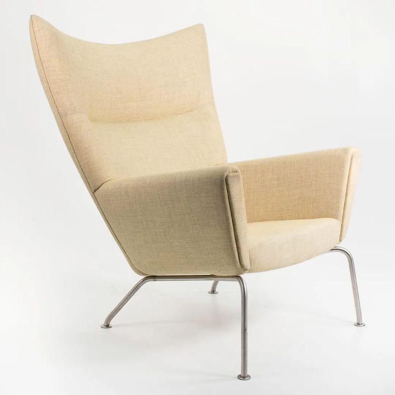 Stainless Steel 2020 CH445 Wing Lounge Chair by Hans Wegner for Carl Hansen in Yellow Fabric For Sale