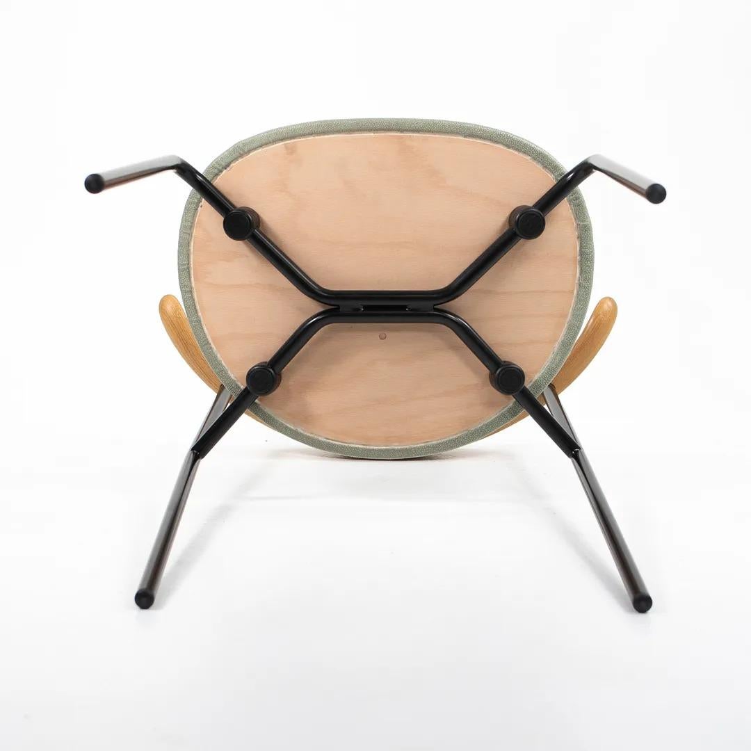 Listed for sale is a CH88P dining chair made with a black powder-coated steel frame, oiled oak back, and a shagreen leather seat by Edelman Leather. The chair, designed by Hans Wegner and produced by Carl Hansen & Son in Denmark, dates to 2020 and