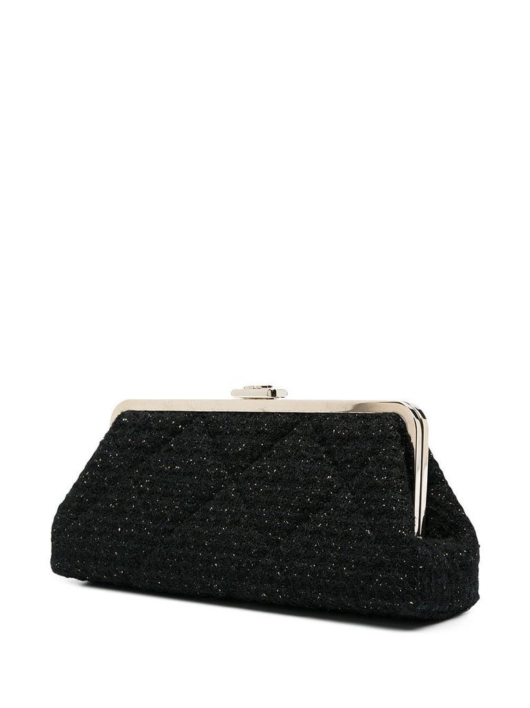 Chanel black tweed clutch bag featuring a top logo claps opening, gold-tone hardware, a diamond stitching, an inside silk lining, inside pockets. 
Circa 2020
Made in France.
In excellent vintage condition. 
Length: 9.4in (24cm)
Height: 4.3in.