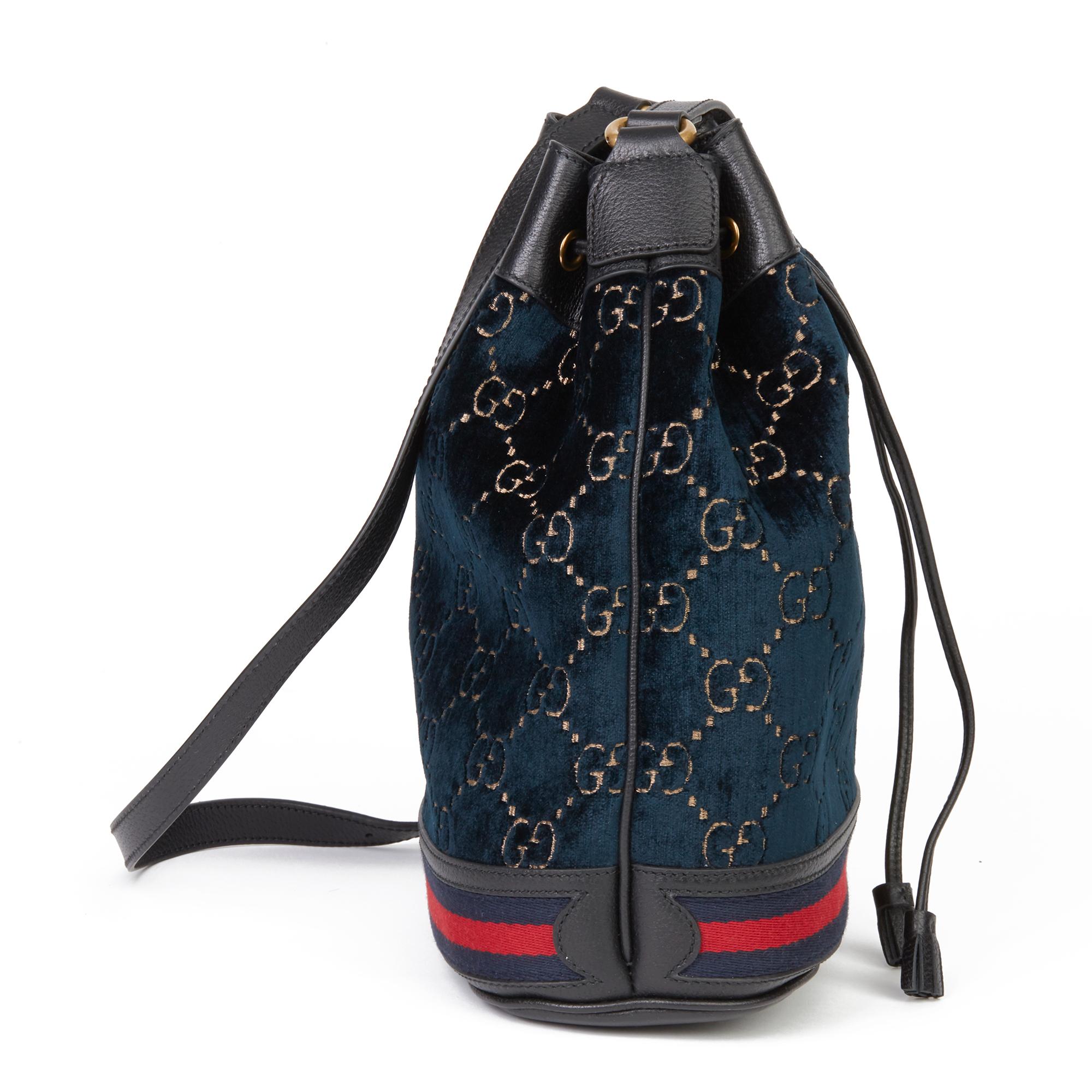 GUCCI
Dark Blue GG Velvet & Black Pigskin Leather Web Bucket Bag

Xupes Reference: HB3642
Serial Number: 574960 520981
Age (Circa): 2020
Accompanied By: Gucci Dust Bag, Care Booklet
Authenticity Details: Serial Sticker (Made in Italy)
Gender: