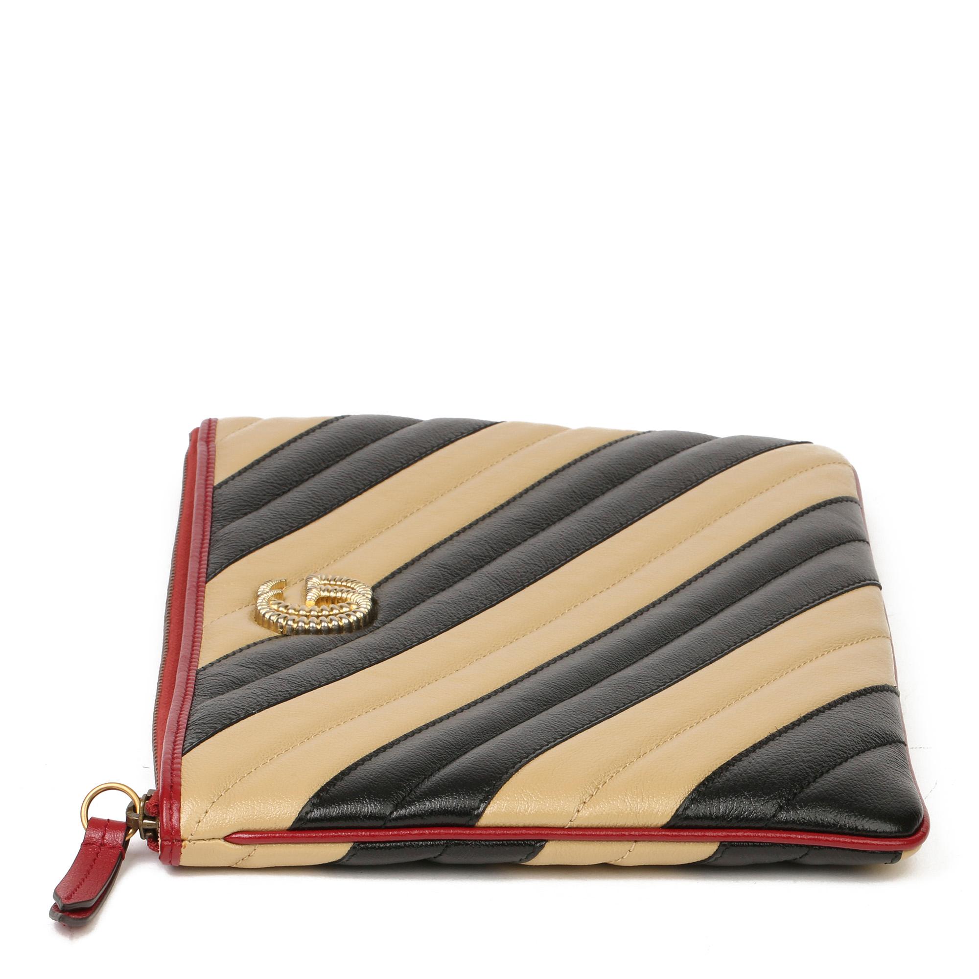 GUCCI
Black, Cream & Red Diagonal Quilted Aged Calfskin Leather Marmont Pouch

Xupes Reference: HB3708
Serial Number: 573814 562600
Age (Circa): 2020
Accompanied By: Gucci Dust Bag, Box, Care Booklet
Authenticity Details: Serial Stamp (Made in