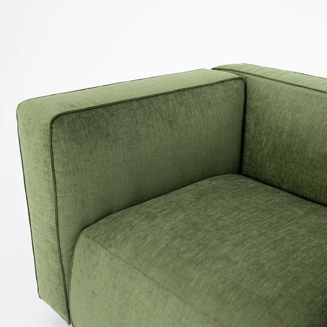 This is a Barber Osgerby Compact Two Seater Sofa, designed by Edward Barber and Jay Osgerby and produced by Knoll. This example was produced in 2020. The fabric looks and feels similar to the Summit fabric by Knoll. It seems like a chenille fabric.