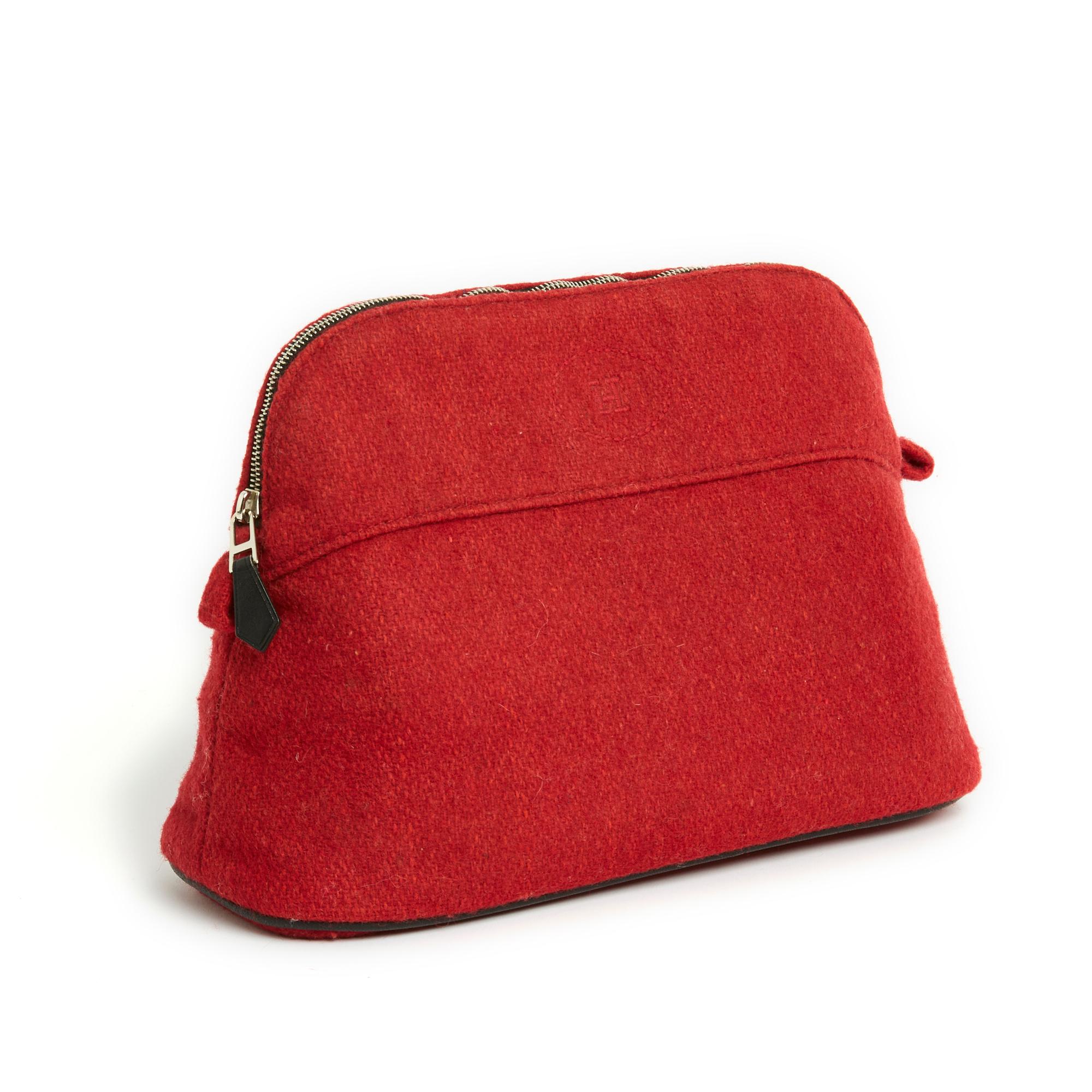 Hermès Pouch Bolide model MM format in red Hermès wool canvas and black leather piping, waterproof lining, closure with a silver metal zip with leather puller, 2 fabric 