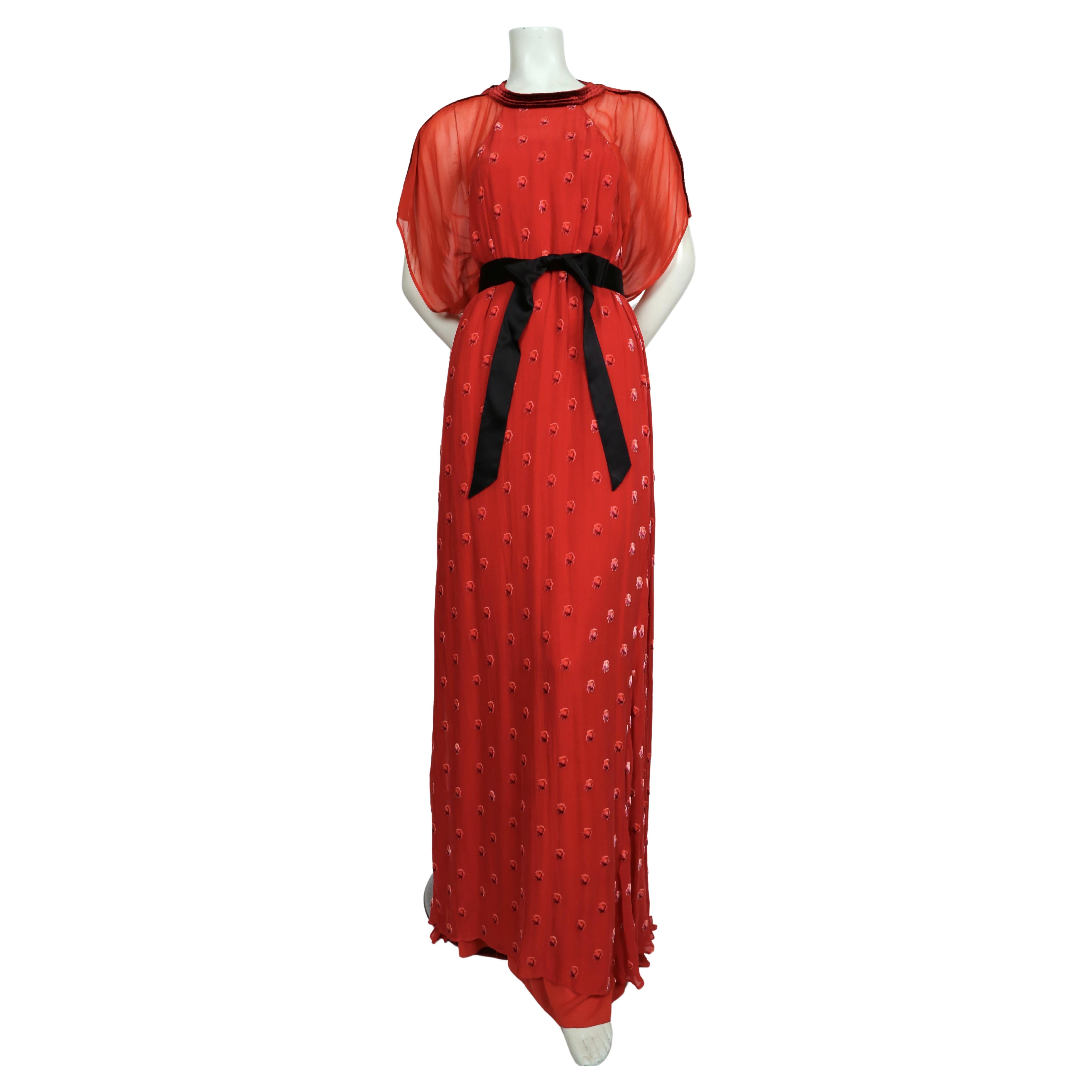 Stunning red sheer silk gown with velvet rose motif from Valentino dating to spring of 2020. Size 6. Approximate measurements for slip (outer floral layer is full): bust 34