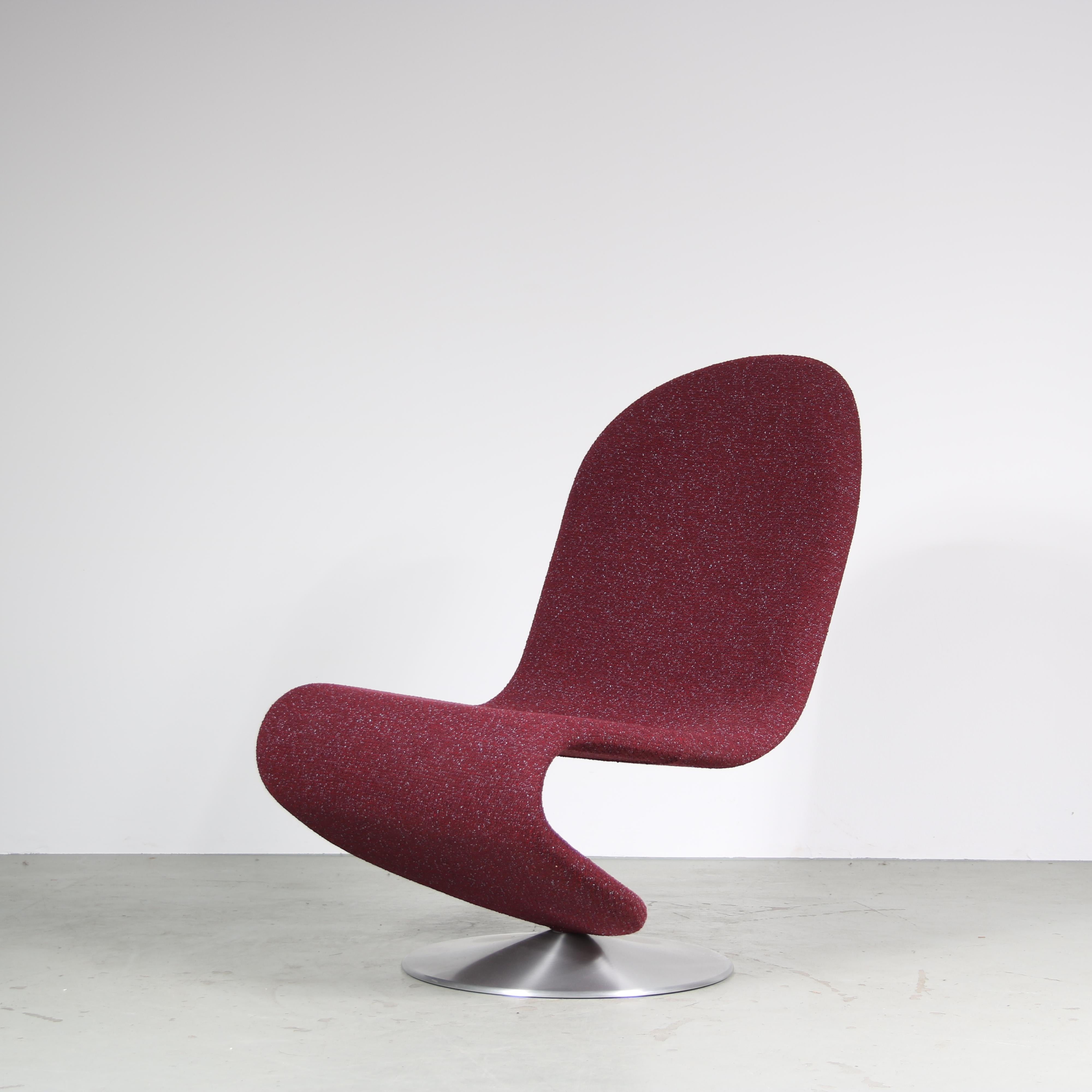 A beautiful “1-2-3” easy chair, a famous design by Verner Panton from the 1970s, manufactured by VerPan in Denmark in the 2020s.

It has a round aluminum metal base and beautiful purple Kvadrat fabric upholstery of the highest quality. These