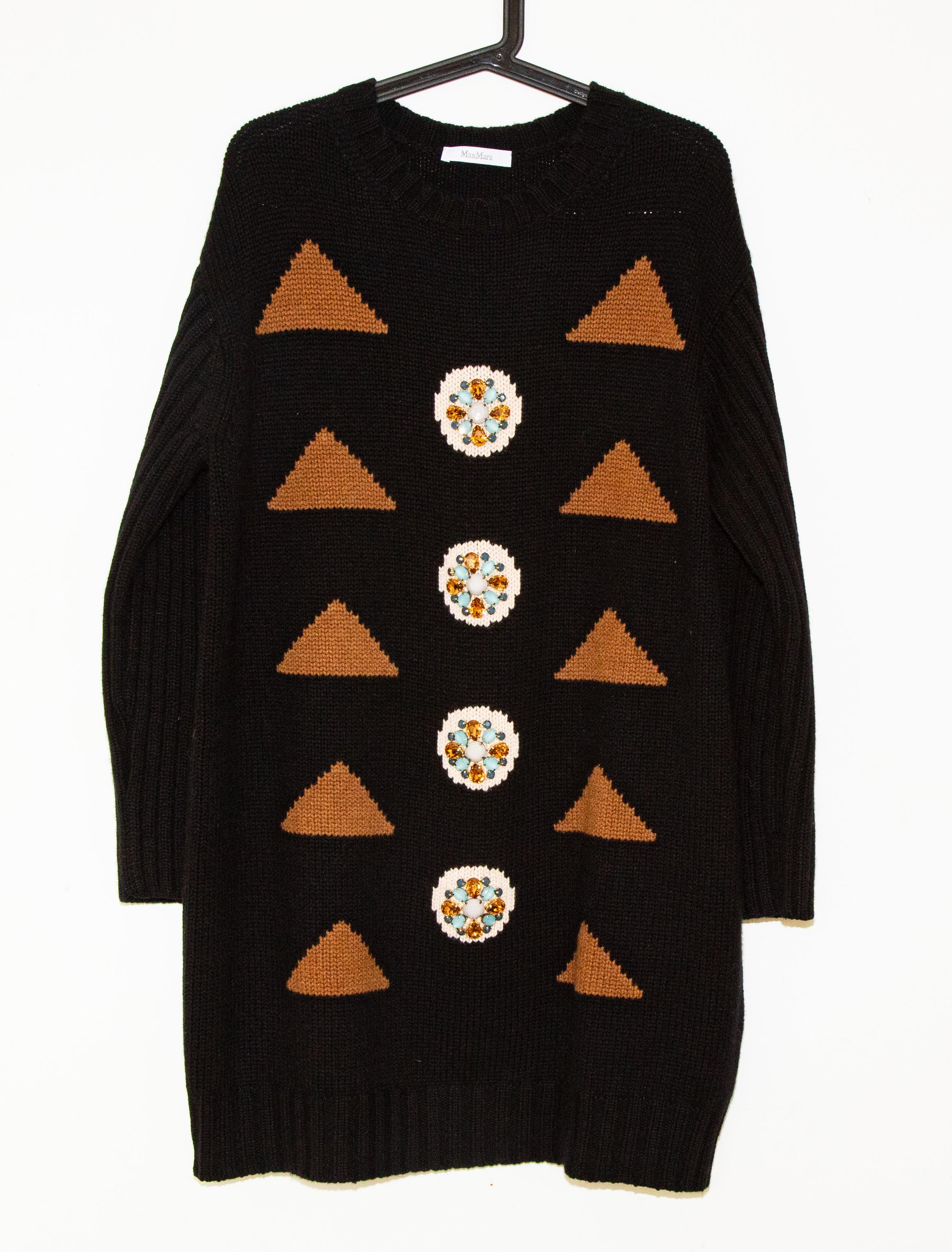 Max Mara Maracas Minikleid aus Wolle und Kaschmir mit Stein- und Kristallverzierungen. Größe L, passt wie L. In perfektem Zustand.

Messungen
Länge:91 cm
Schulterbreite:49 cm