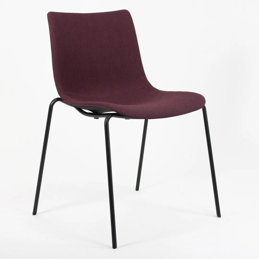Listed for sale is a BA002F Preludia 4-Leg Dining Chair, designed by Brad Ascalon and produced by Carl Hansen & Son in Denmark. The chair is made with a black powder-coated steel frame and a purple Fjord 591 fabric seat (we believe this to be the
