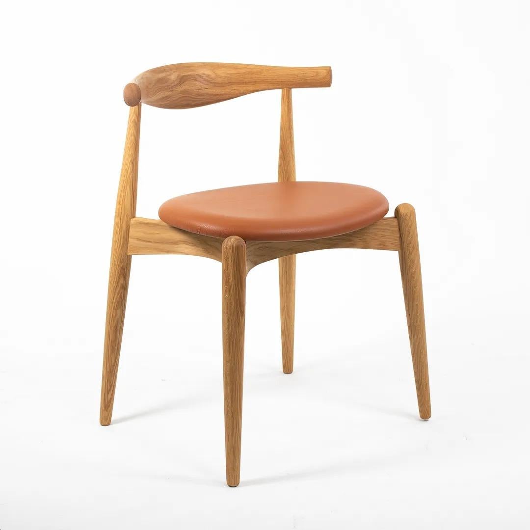 Scandinavian Modern 2021 CH20 Elbow Dining Chair by Hans Wegner for Carl Hansen in Oak & Tan Leather For Sale