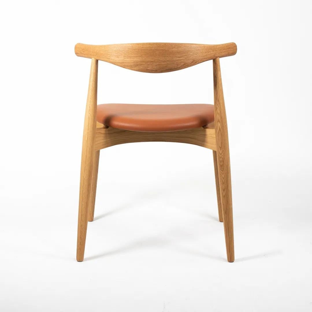 2021 CH20 Elbow Dining Chair by Hans Wegner for Carl Hansen in Oak & Tan Leather In Good Condition In Philadelphia, PA
