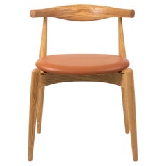 2021 CH20 Silla de comedor con codo de Hans Wegner para Carl Hansen en roble y piel tostada