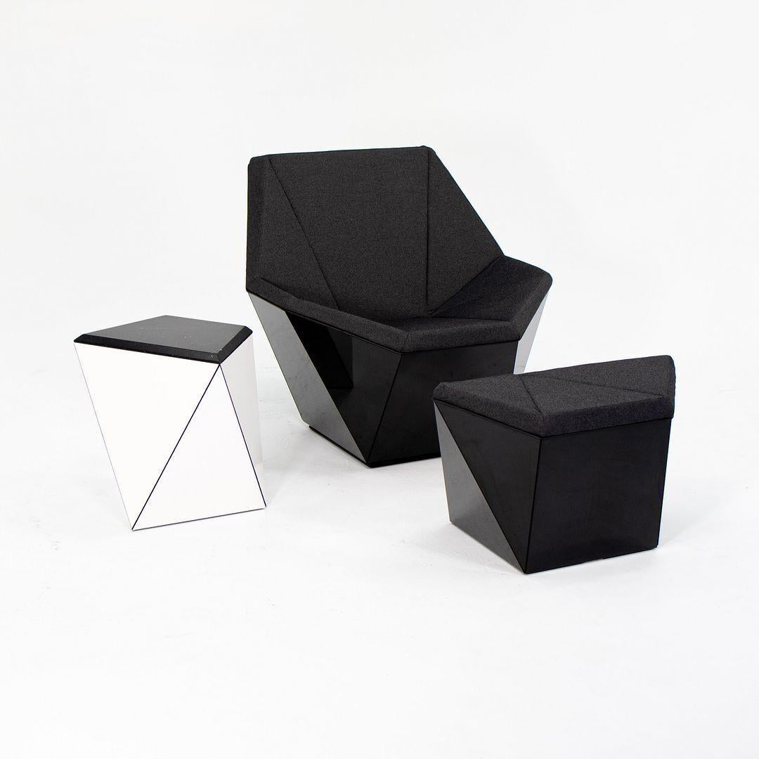 We present this rare and unusual Washington Prism lounge chair and ottoman, designed by Sir David Adjaye and produced by Knoll. First off, it should be noted that the set is free of any substantial wear, though because its highly reflective, it