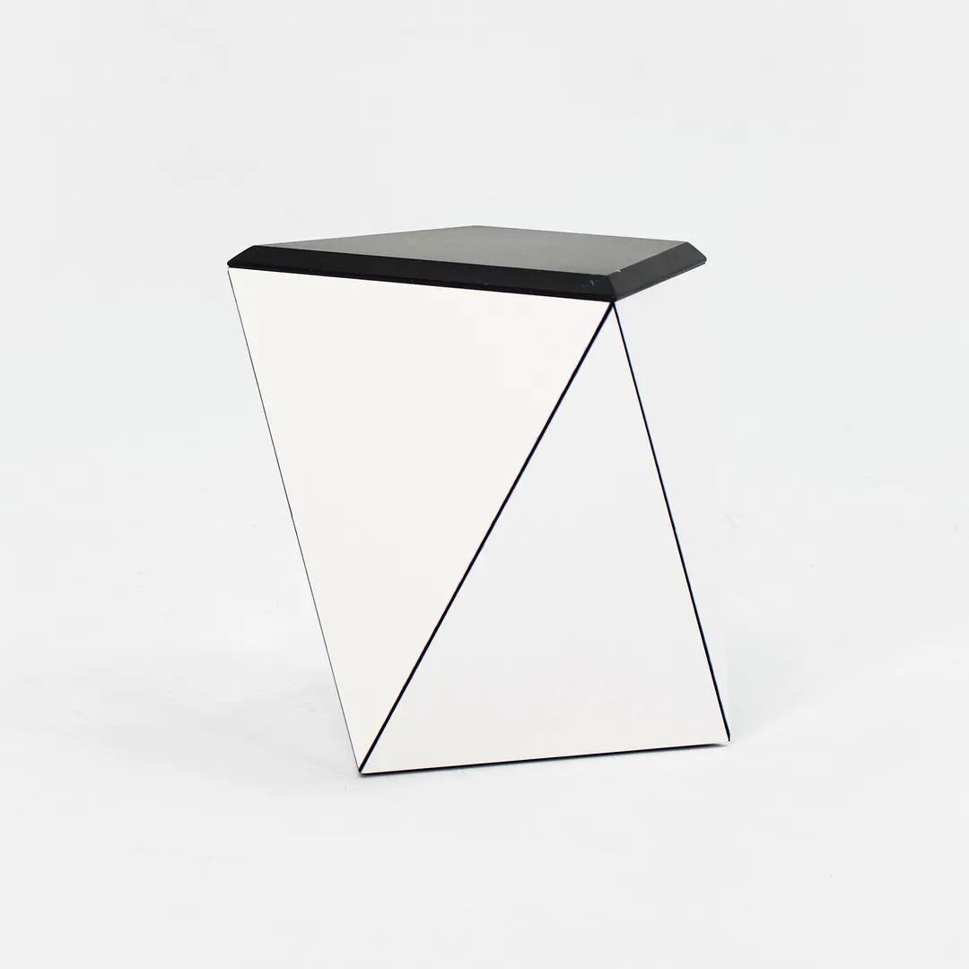 This is a Washington Prism side table designed by Sir David Adjaye and produced by Knoll. This particular example was specified with a gloss white shell and satin black marble top. It was produced in 2021 and was acquired directly from a Knoll