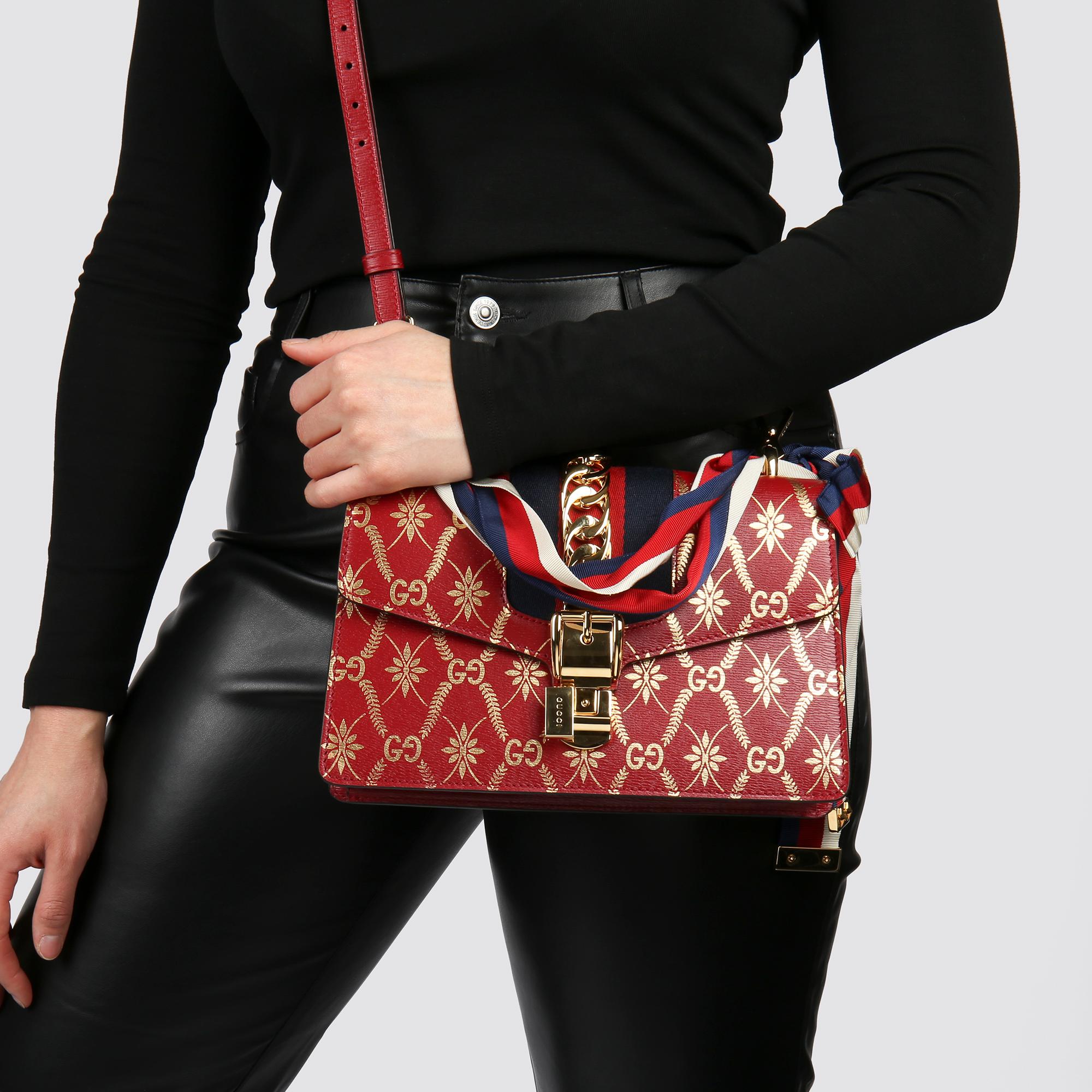 GUCCI
Red & Gold Calfskin Leather Top Handle Small Sylvie 

Xupes Reference: HB3766
Serial Number: 524401 493075
Age (Circa): 2021
Accompanied By: Gucci Dust Bag, Shoulder Strap
Authenticity Details: Date Stamp (Made in Italy) 
Gender: Ladies
Type: