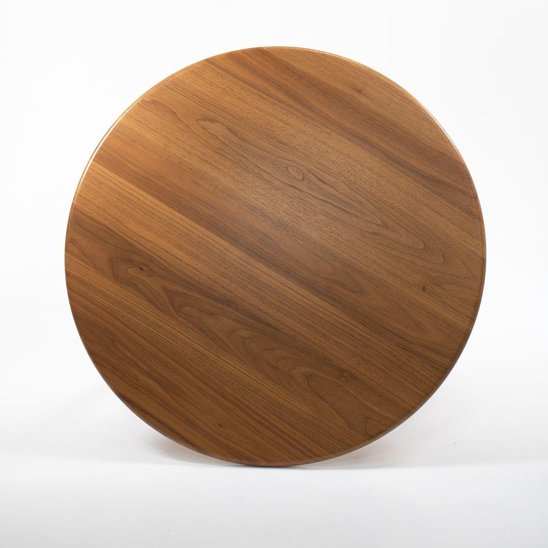 This is a CH008 coffee table made with a lacquered walnut oak top and legs. The table, designed by Hans Wegner and produced by Carl Hansen & Son in Denmark, dates to circa 2021 and is guaranteed as authentic. Condition is excellent with only light