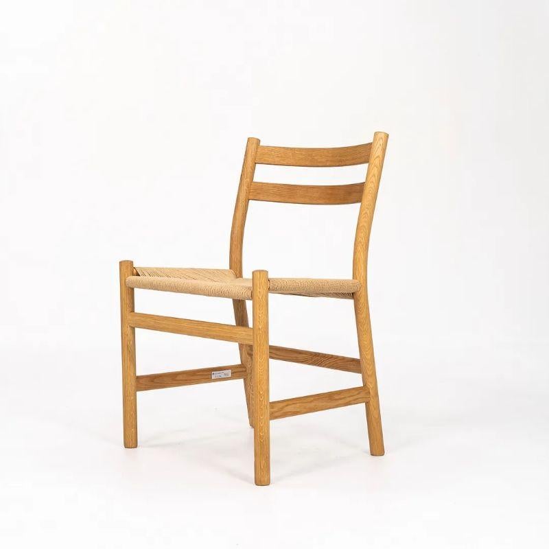 This is a CH47 Dining Chair made with a solid oiled oak frame and natural paper cord seat. Designed by Hans Wegner and produced by Carl Hansen & Son in Denmark, this chair dates to circa 2021 and is guaranteed as authentic. Condition is excellent