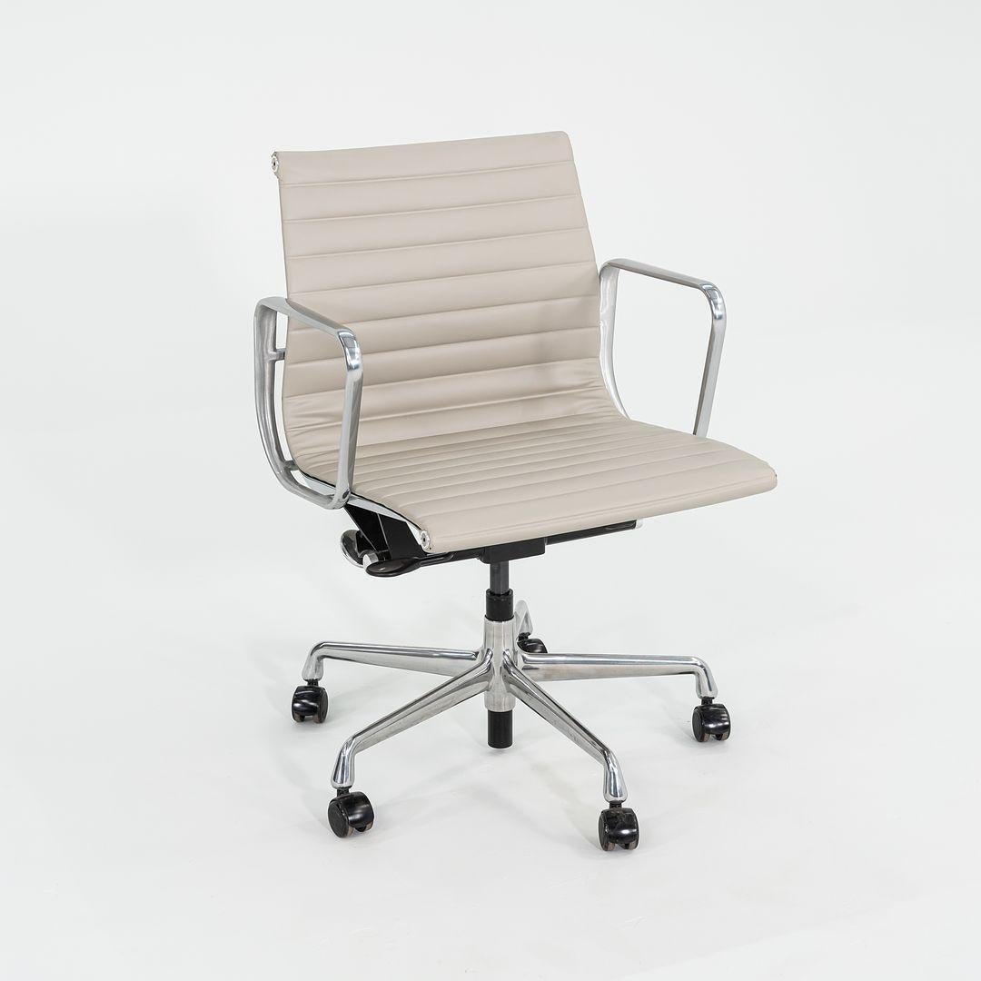 This is an Eames Aluminum Group Management Desk Chair, model EA335, initially designed by Charles and Ray Eames for Herman Miller in 1958. These examples date to 2021. The listed price includes one chair, and we have several available for purchase.