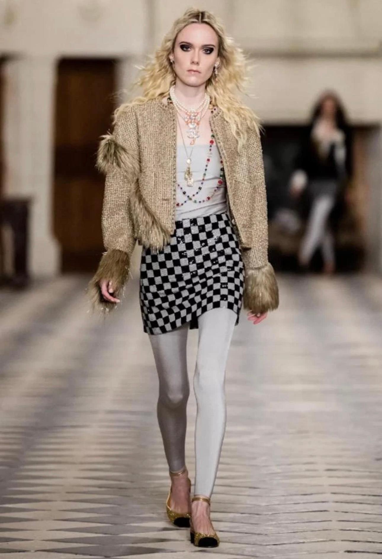 Stunning CHANEL
Jacket, Coat - P71081

Glittery Tweed: Faux fur accents and stunning detailing.
Excellent Pre-Owned Condition. Worn less than a handful of times
 

This is a stunning beige/pale gold tone tweed Jacket, from Chanel designed in a
