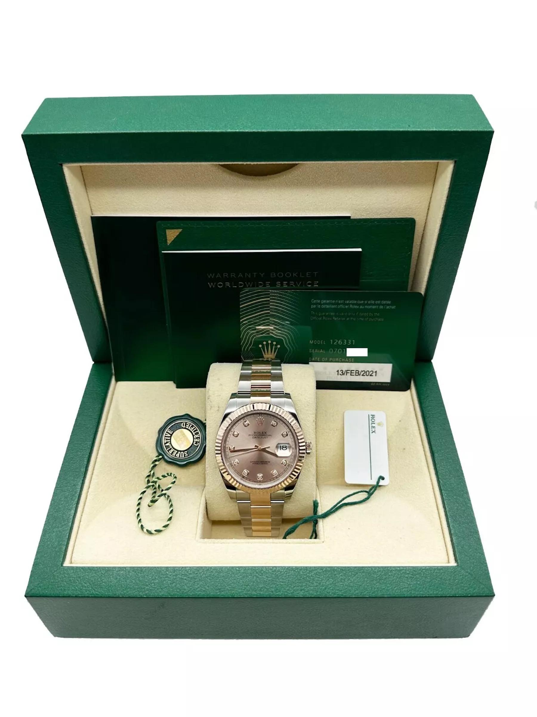 Style Number: 126331
Serial: 07019***
Year: 2021
Model: Rolex Datejust 41
Case Material: Stainless Steel 
Band: 18K Rose Gold & Stainless Steel 
Bezel: 18K Rose Gold 
Dial: Original Sundust Diamond Dial 
Face: Sapphire Crystal 
Case Size: 41mm