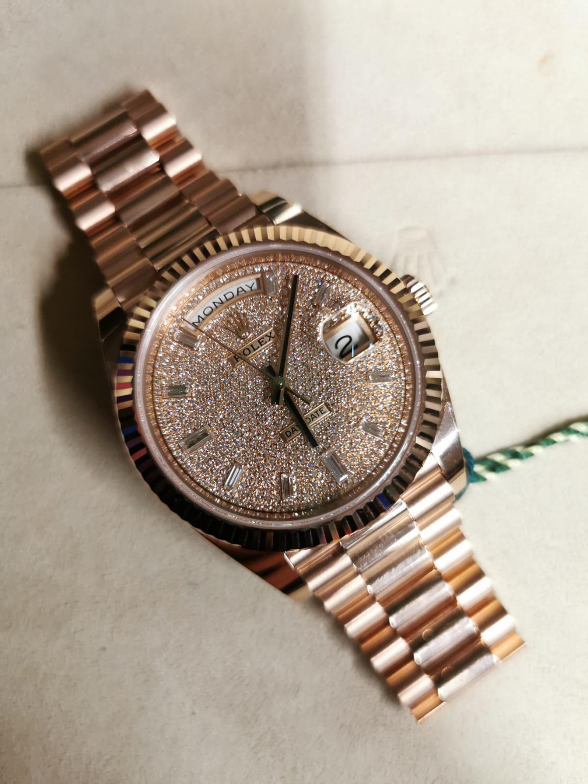 The Oyster Perpetual Day-Date 40 in 18 ct Everose gold with a diamond-paved dial, Fluted bezel and a President bracelet. The Day-Date was the first watch to indicate the day of the week spelt out in full when it was first presented in 1956.

A