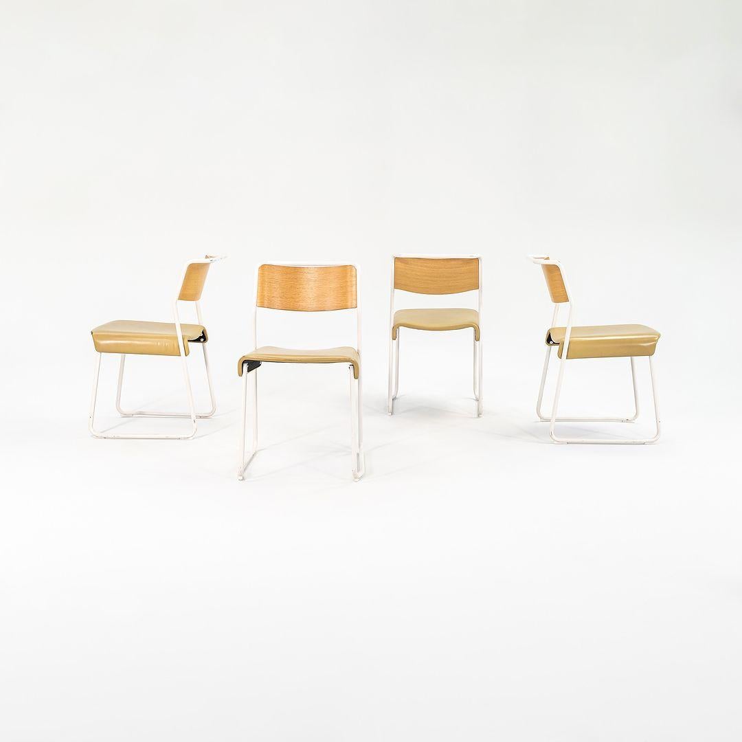 This is a set of four 'Canteen' Utility Chairs, designed by Ed Carpenter and Andr√© Klauser for Very Good and Proper in 2009. This set dates to 2021, and the listed price includes the set of four. Their design features a tubular steel frame having a