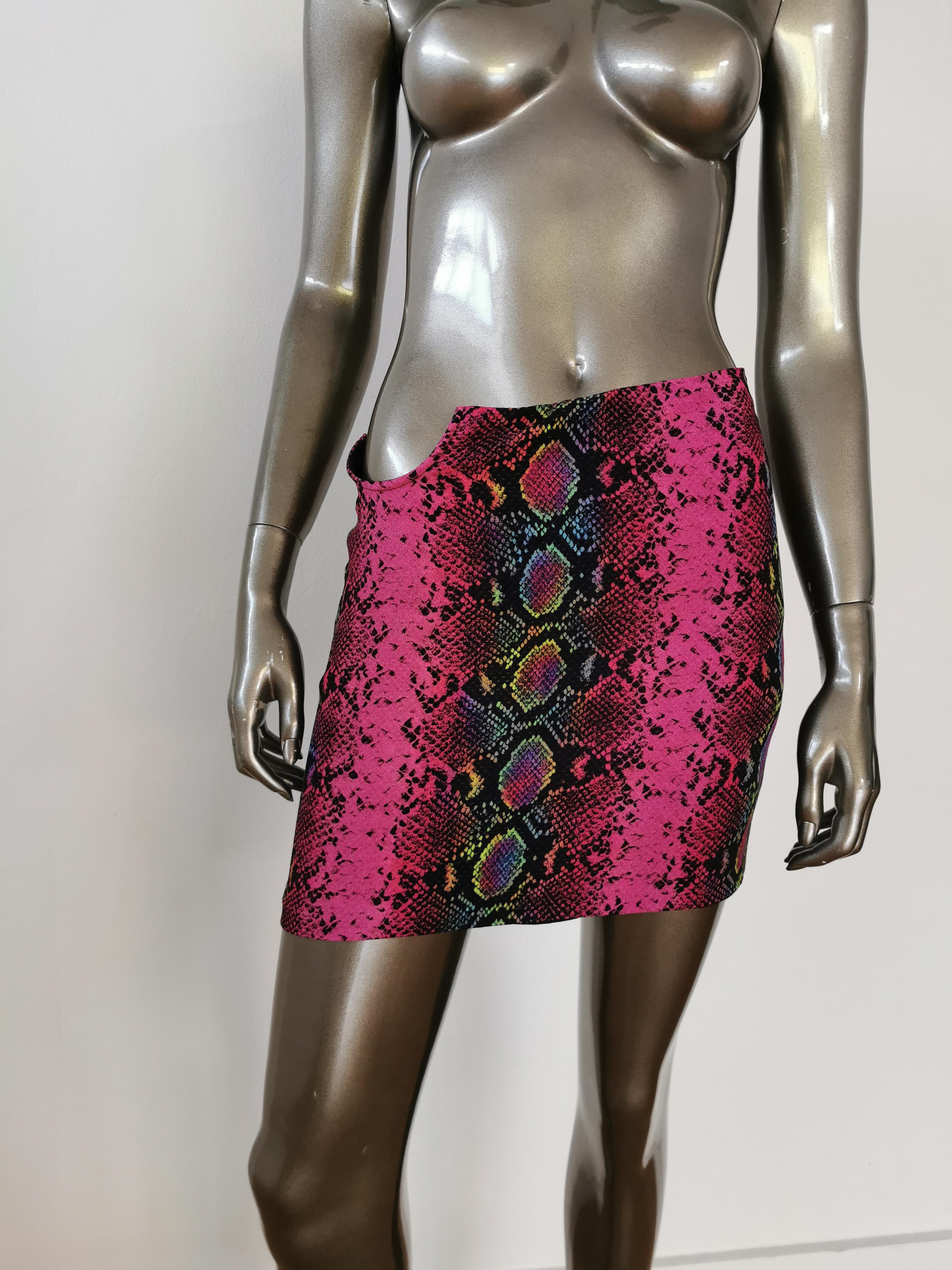 Snake-embossed viscose twill mini skirt in pink featuring multicolor snake pattern printed throughout. Mid-rise. Cut-out with O-ring hardware at hem. Zip closure at side. Darts at back. Viscose and silk-blend satin lining in black. Black hardware.