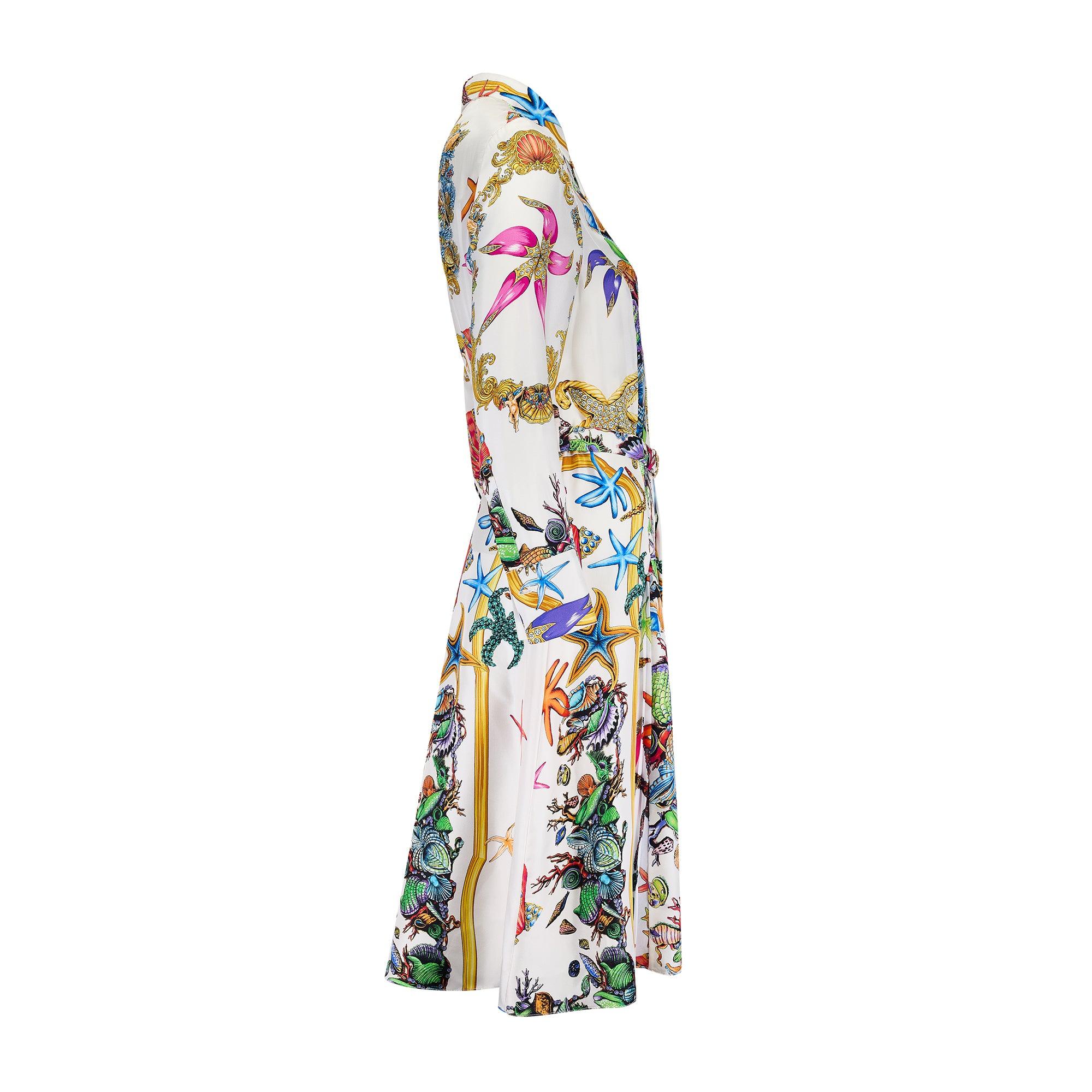 This silk dress was designed by Versace as part of the brand’s Spring 2021 collection.  The Vogue review described the models on the runway as, “mythical citizens rising from the deep blue in an oceanic make-do and mend of starfish, coral, and