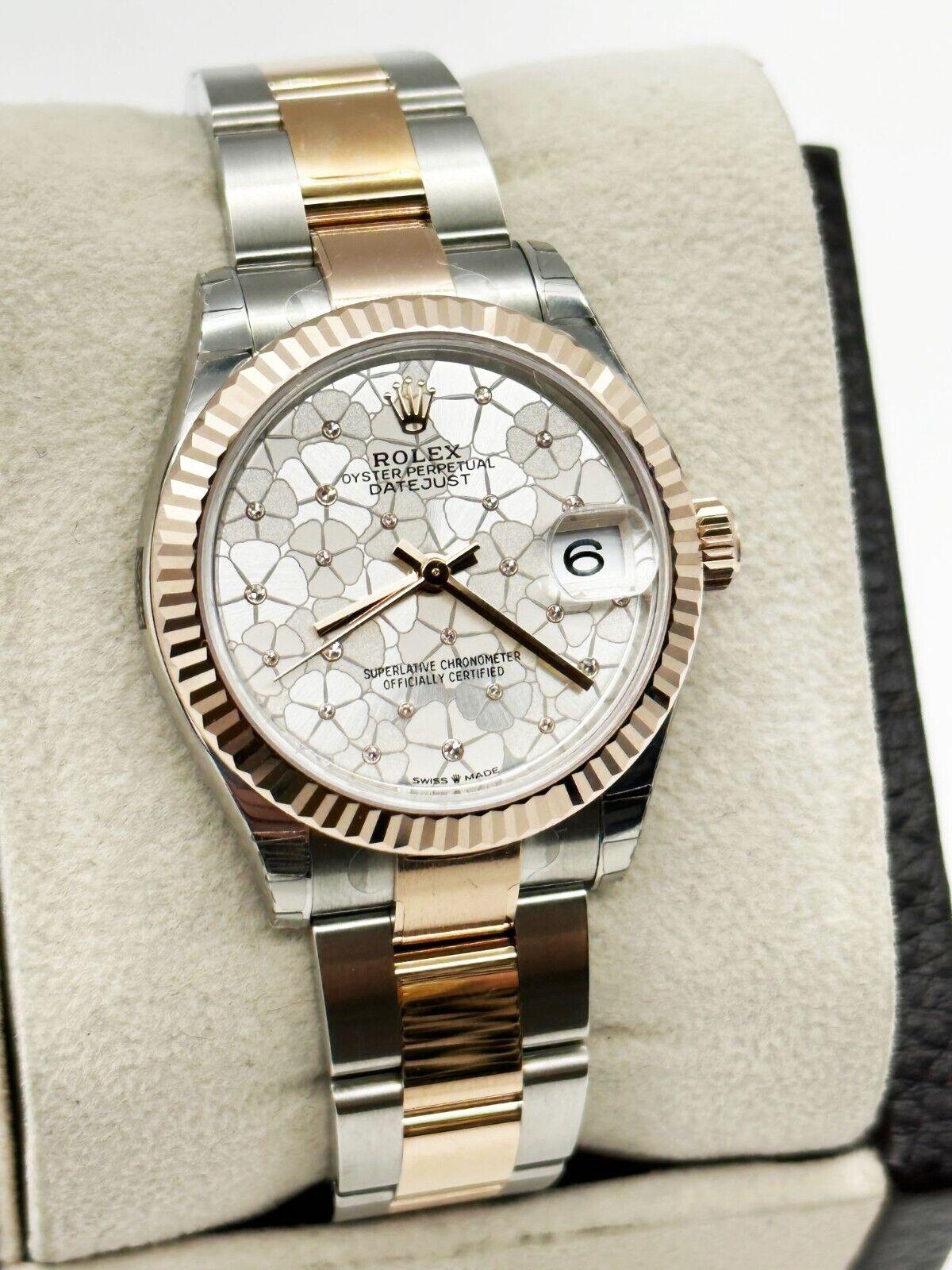 Style Number: 278271

Serial: L7727***

Year: 2022

Model: Datejust 

Case Material: Stainless Steel 

Band: 18K Rose Gold & Stainless Steel 

Bezel: 18K Rose Gold  

Dial: Original Floral Diamond Dial 

Face: Sapphire Crystal 
 
Case Size: 31mm