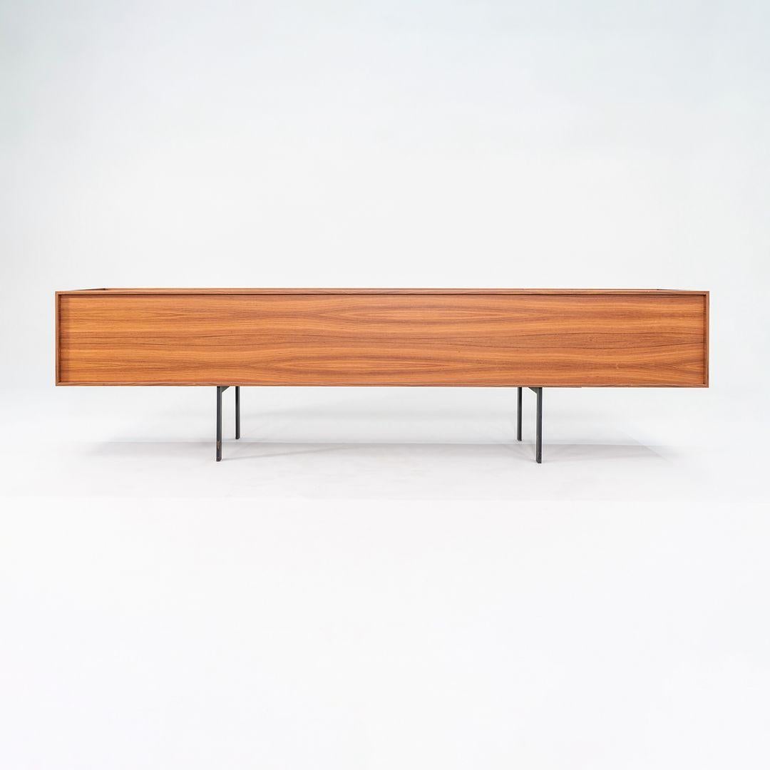 This is a Lochness cabinet made of natural palisander rosewood veneer with a black metal base. The cabinet was designed by Piero Lissoni and produced by Cappellini in Italy. It dates to circa 2022 and is guaranteed as authentic. Condition is very