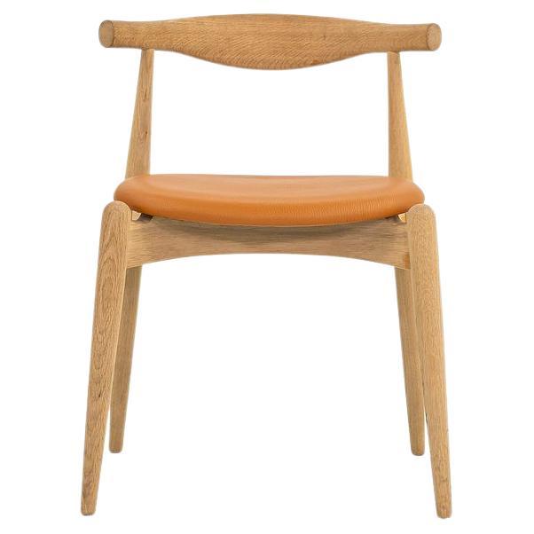 2022 Hans Wegner for Carl Hansen CH20 Elbow Chair Oak with Caramel Leather Pad