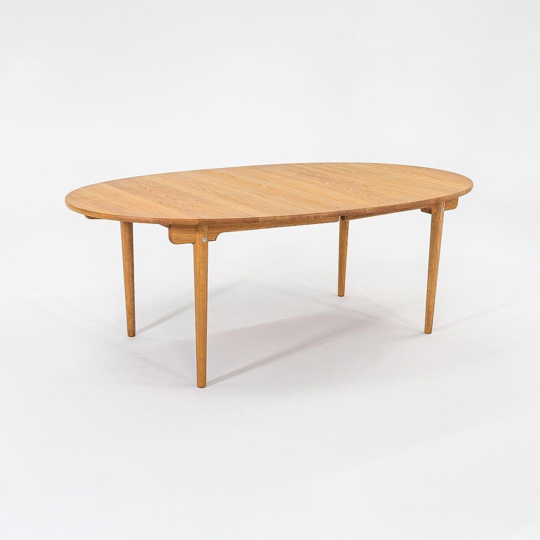 2022 Hans Wegner for Carl Hansen CH338 Dining Table with Two Leaves in Oiled Oak In Excellent Condition In Philadelphia, PA