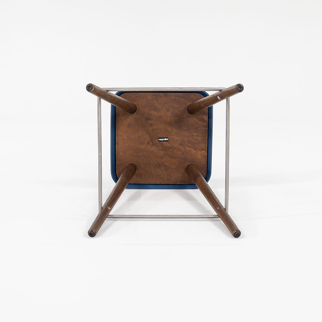 Se vende un taburete de mostrador Daddy Longlegs con patas de madera de fresno teñida de color nogal y asiento teñido de azul con reposapiés de acero inoxidable. El taburete fue diseñado por Martin Solem y producido por Cappellini¬†en Italia. Data